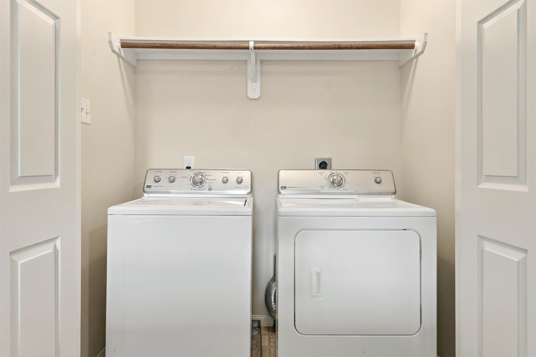 The laundry room is conveniently located on the 2nd floor - no need to haul laundry baskets down the stairs!  There is a shelf for your cleaning supplies and hanging rod for delicates.  Washer and dryer can convey with the home.