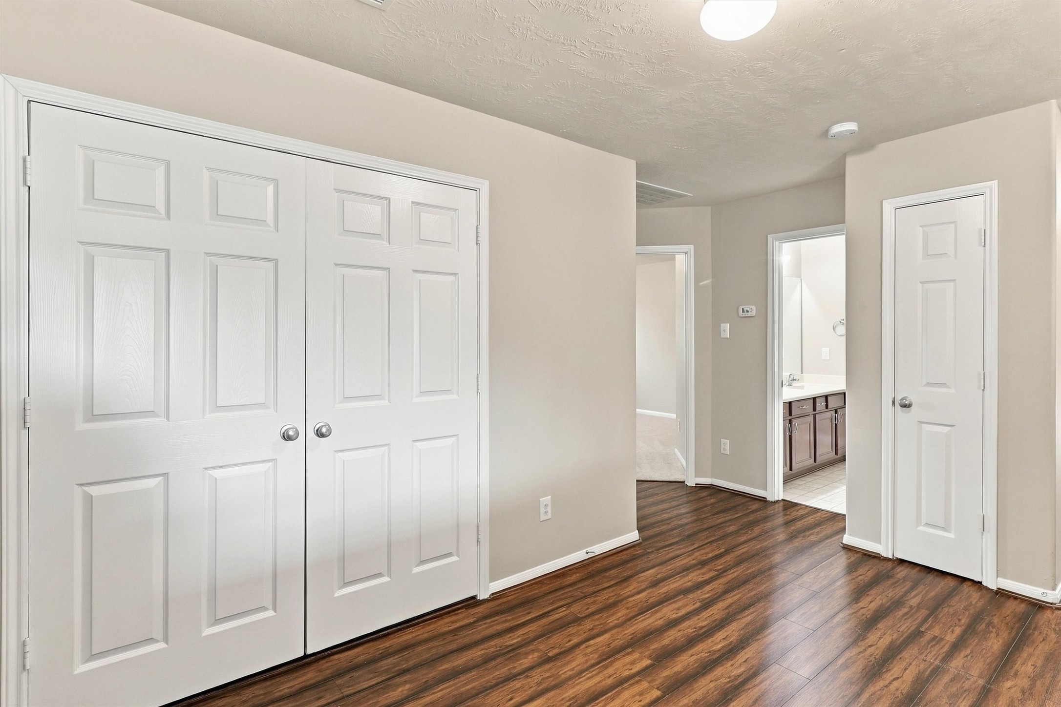 Another view of the game room shows the 2nd bath and 2 more bedrooms.