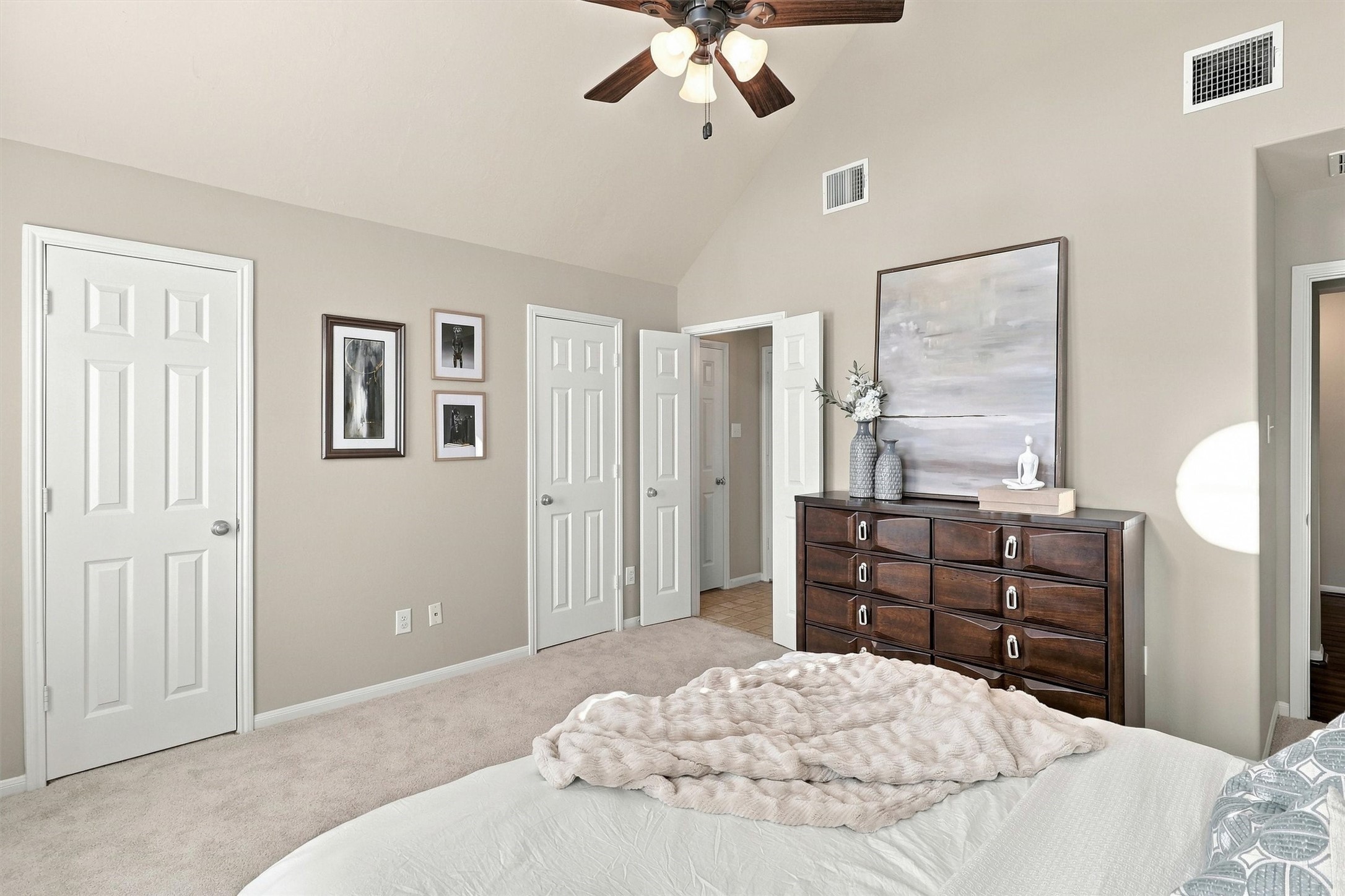 Double doors at the back of the bedroom open to your walk-in closet.