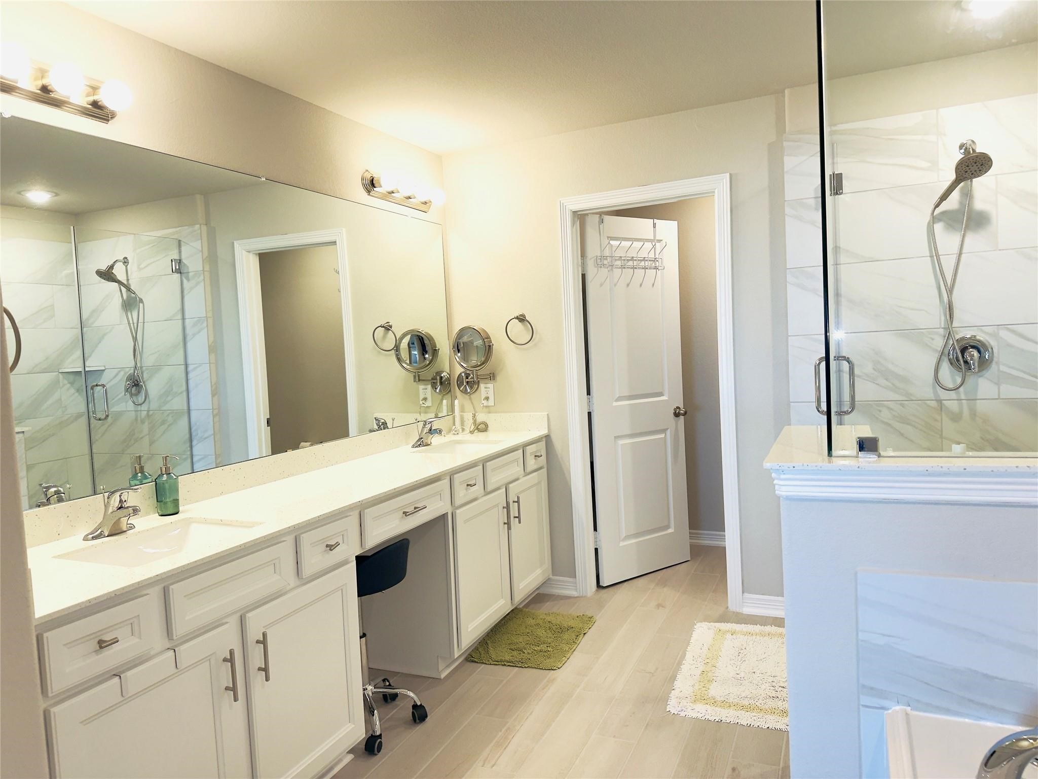 Double sinks, private toilet room, separate shower & tub