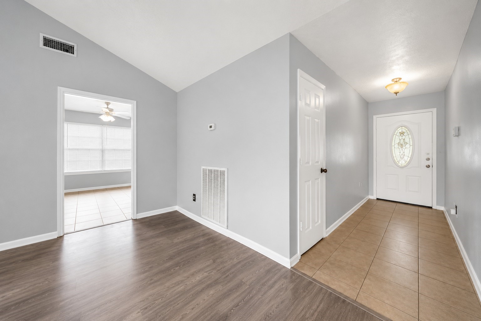 Step inside to a welcoming entryway featuring updated flooring and a bright, neutral color palette. Step inside to a welcoming entryway featuring updated flooring and a bright, neutral color palette.