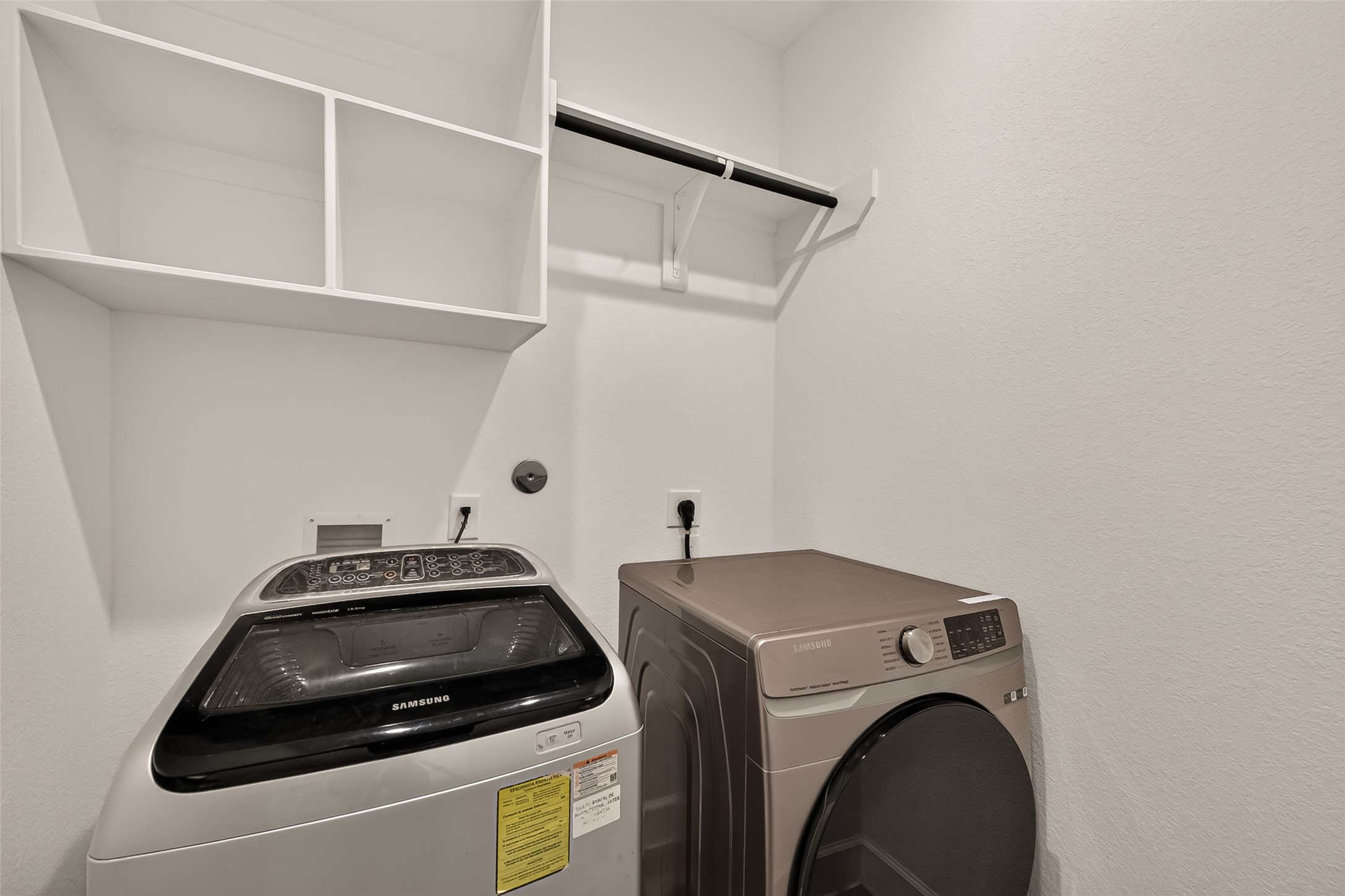 Upon entering the laundry room, you're greeted by a bright and inviting atmosphere that makes household chores feel like a breeze.