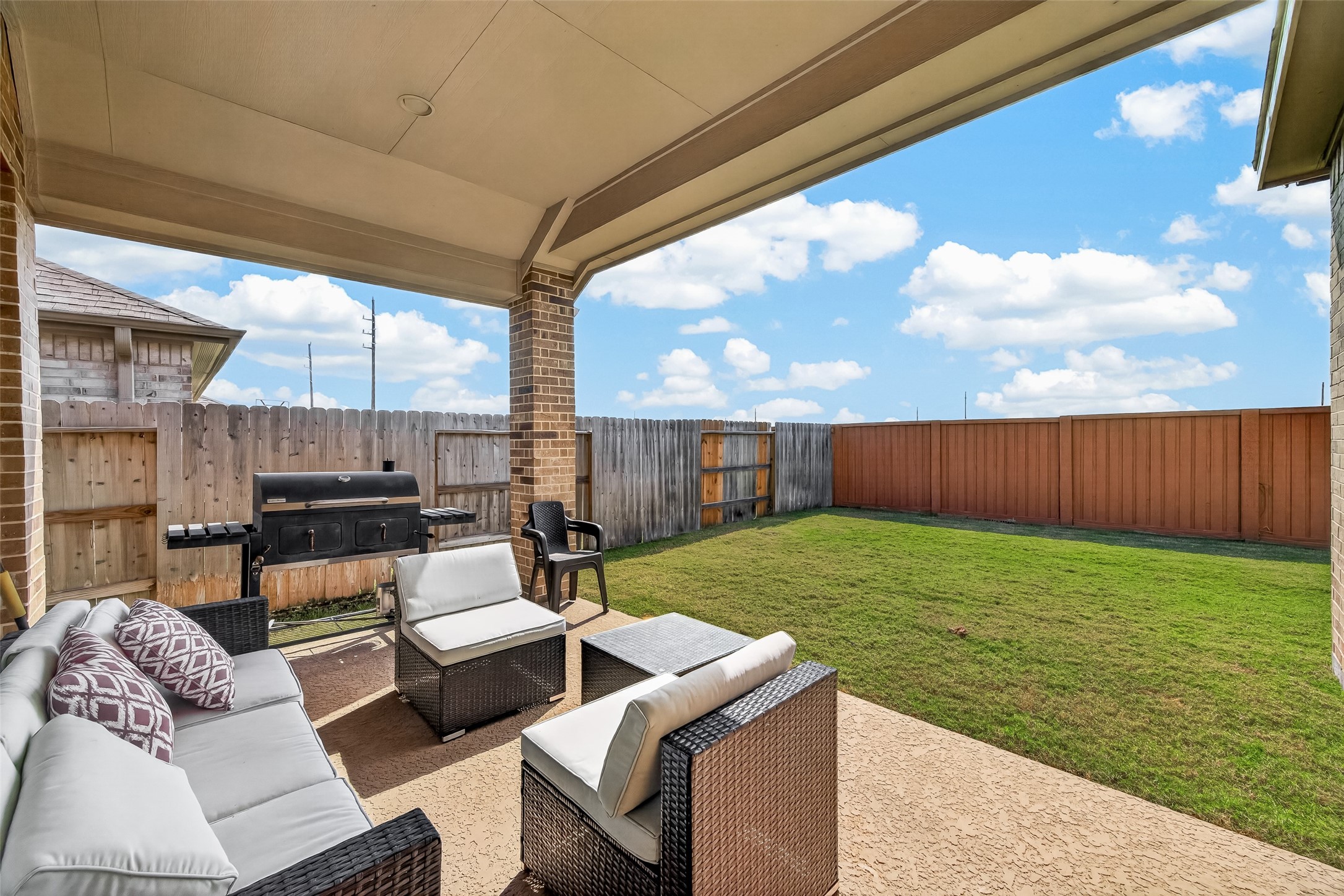 Step out back to a covered patio, where you can add your patio furniture and grill to create an amazing outdoor entertaining or alfresco dining space. Come and see this property today!