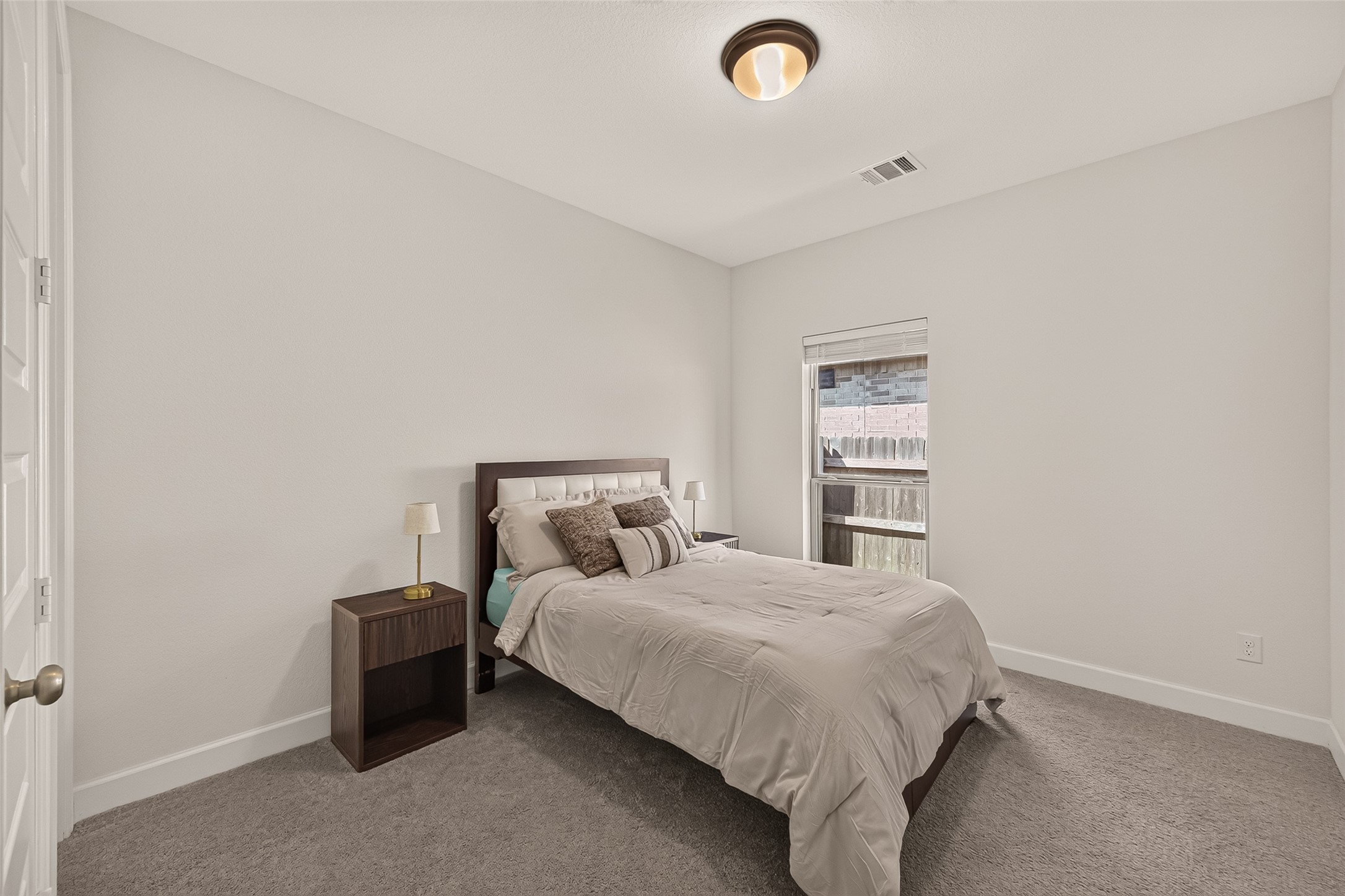 Step into luxury with this impeccable secondary bedroom, a canvas for your decorative skills.