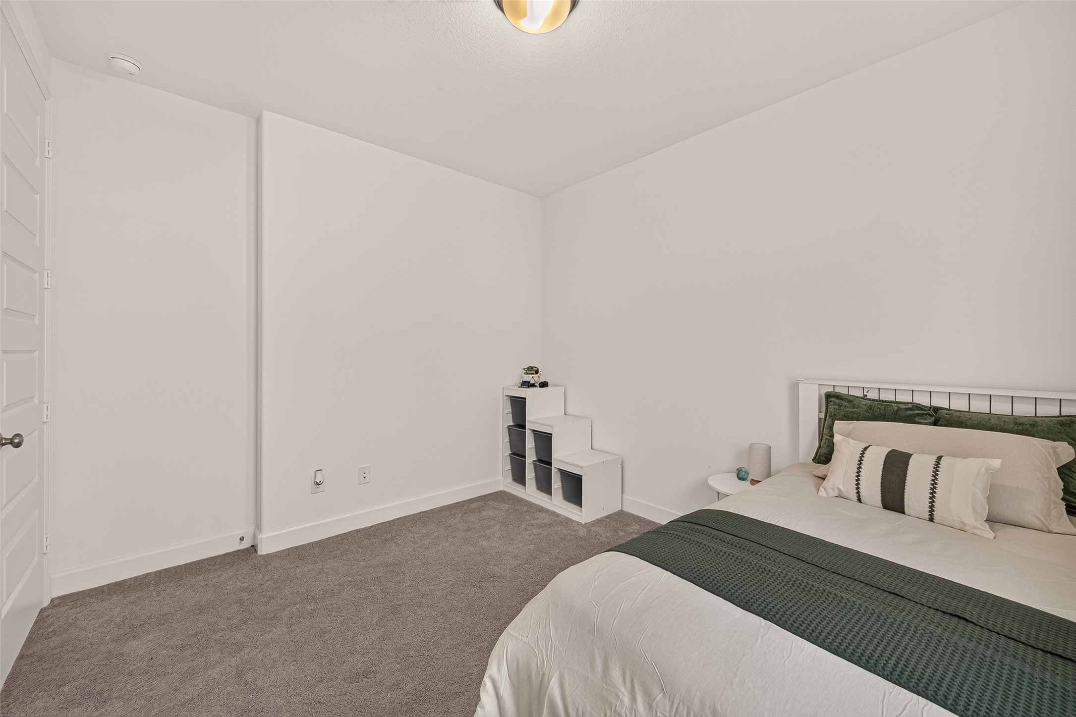 You can arrange your furniture with ease inside this spacious secondary bedroom.