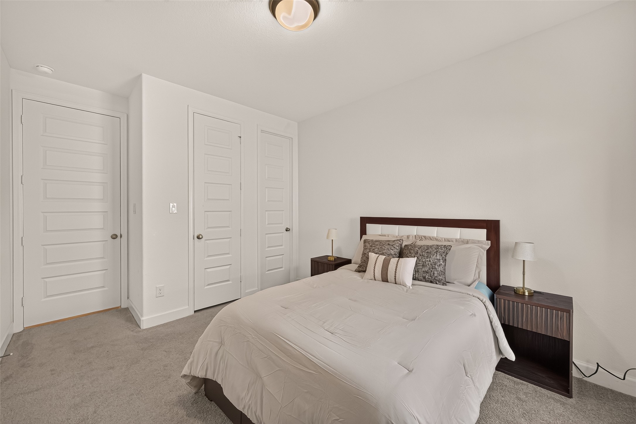 With ample space for a bed, and additional furnishings, this bedroom offers both comfort and functionality.