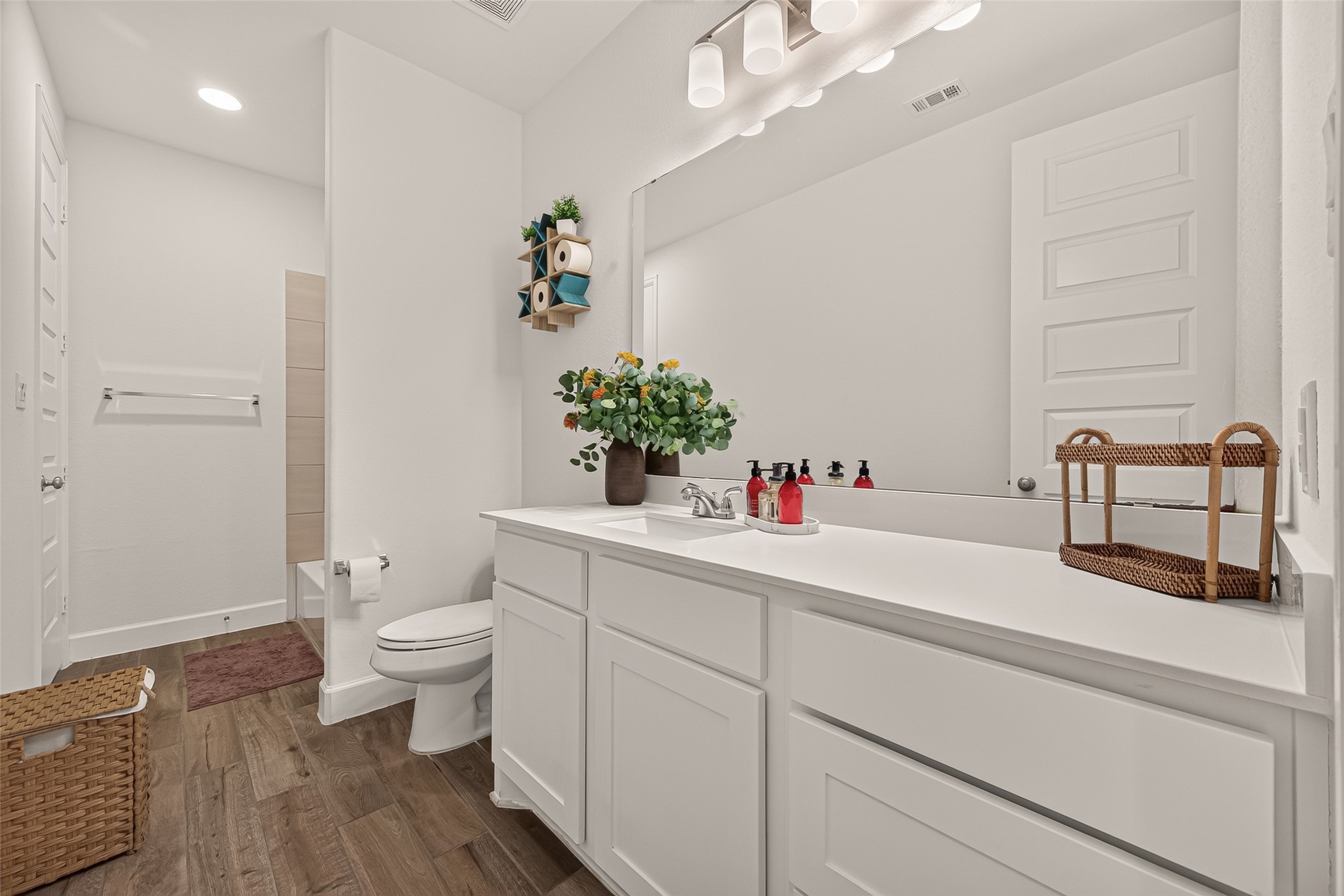 The secondary bathroom is ample and well lighted.
