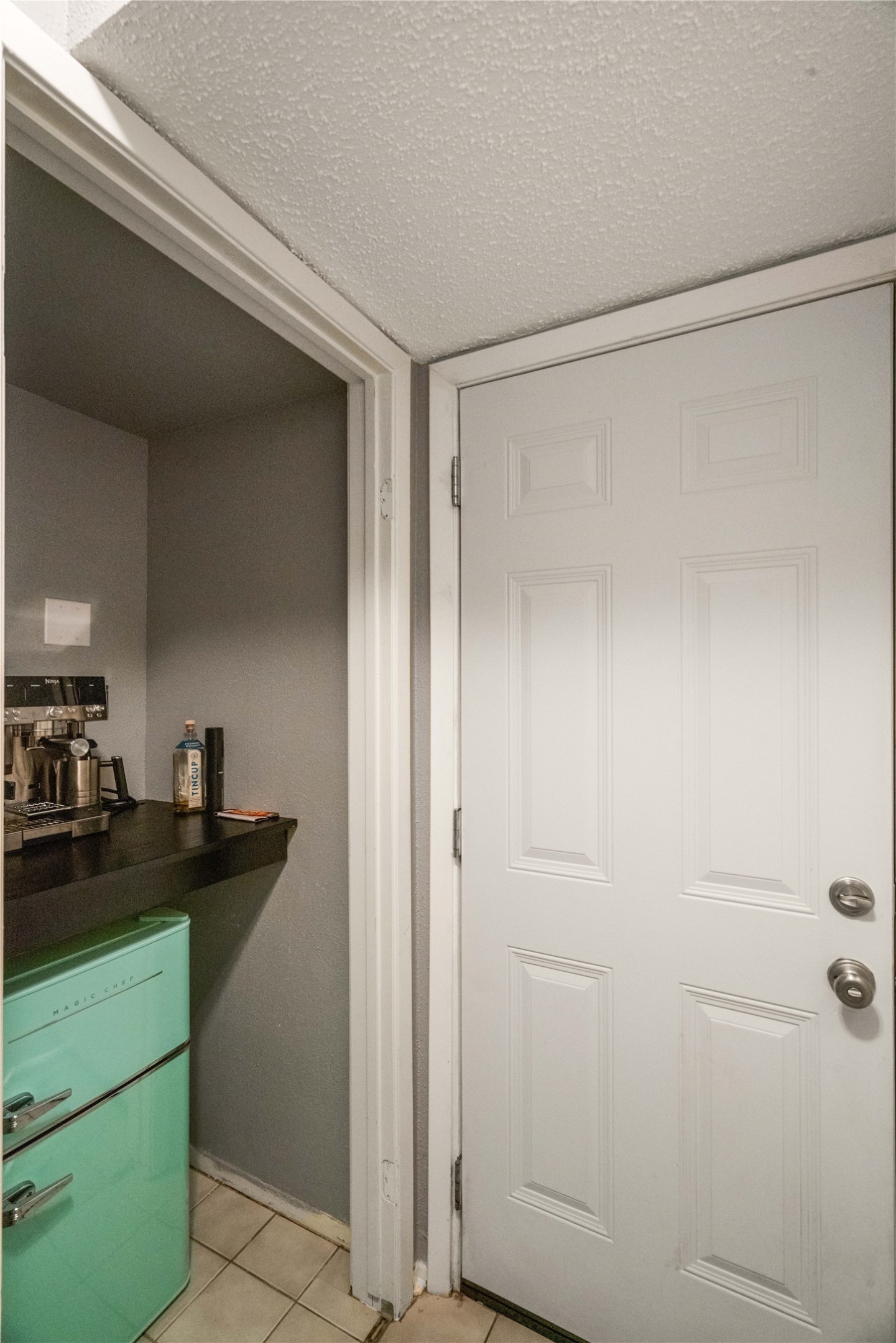 Just off the kitchen is a repurposed closet made into a cute coffee bar.