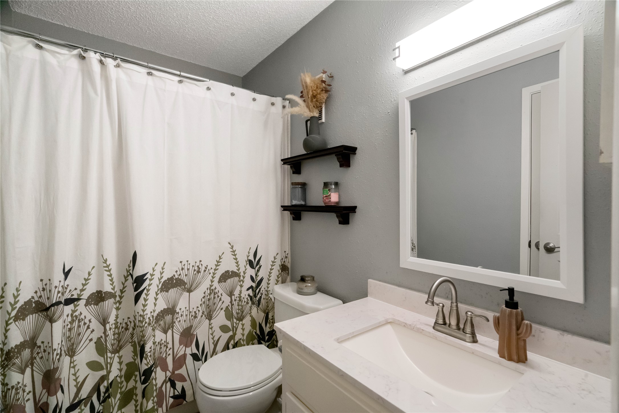 2nd full bath also updated with a granite countertop and undermount sink.