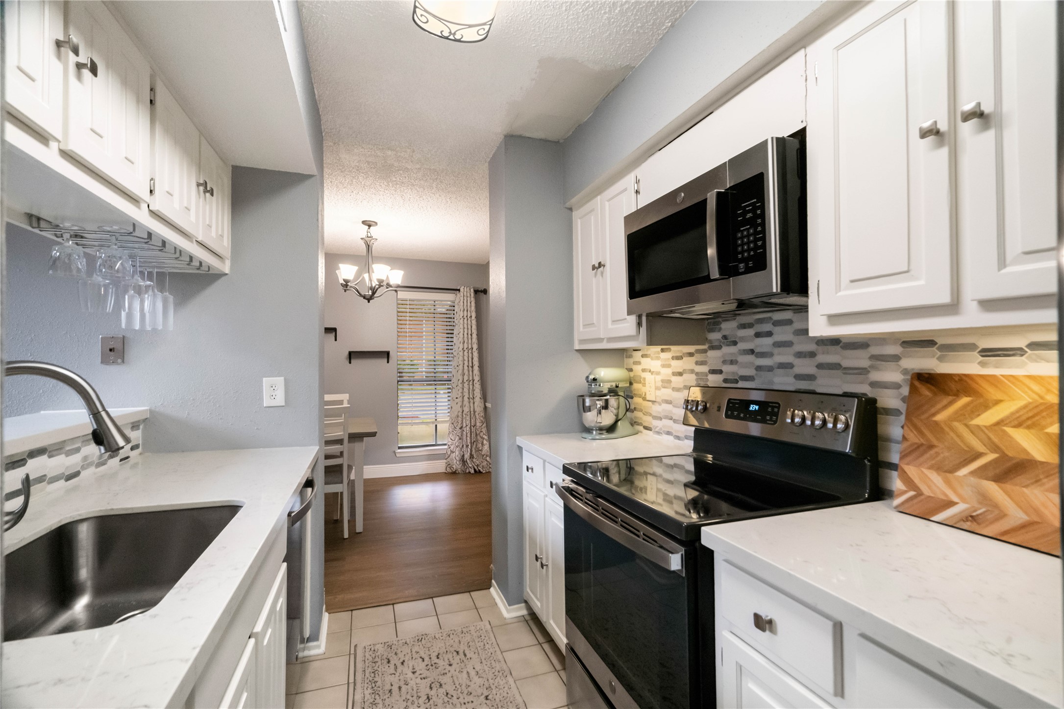 kitchen updated with new backsplash and granite countertops.