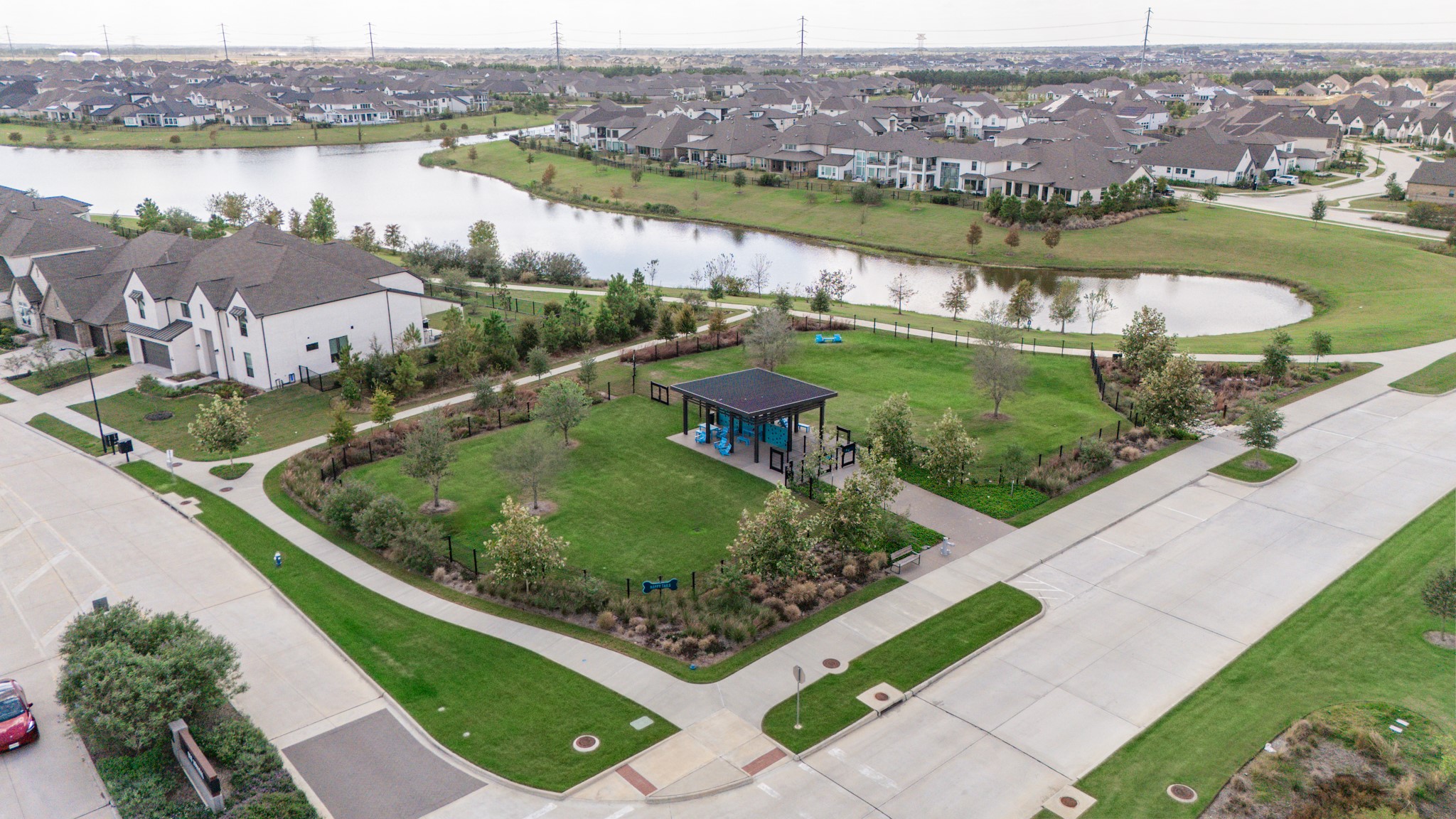 Charming community with picturesque lake views, lush green spaces, and modern amenities, perfect for living and outdoor enjoyment.
