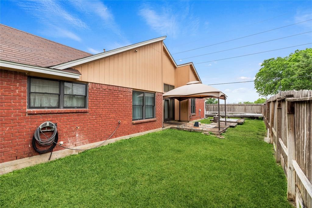 Big yard with a covered gazebo