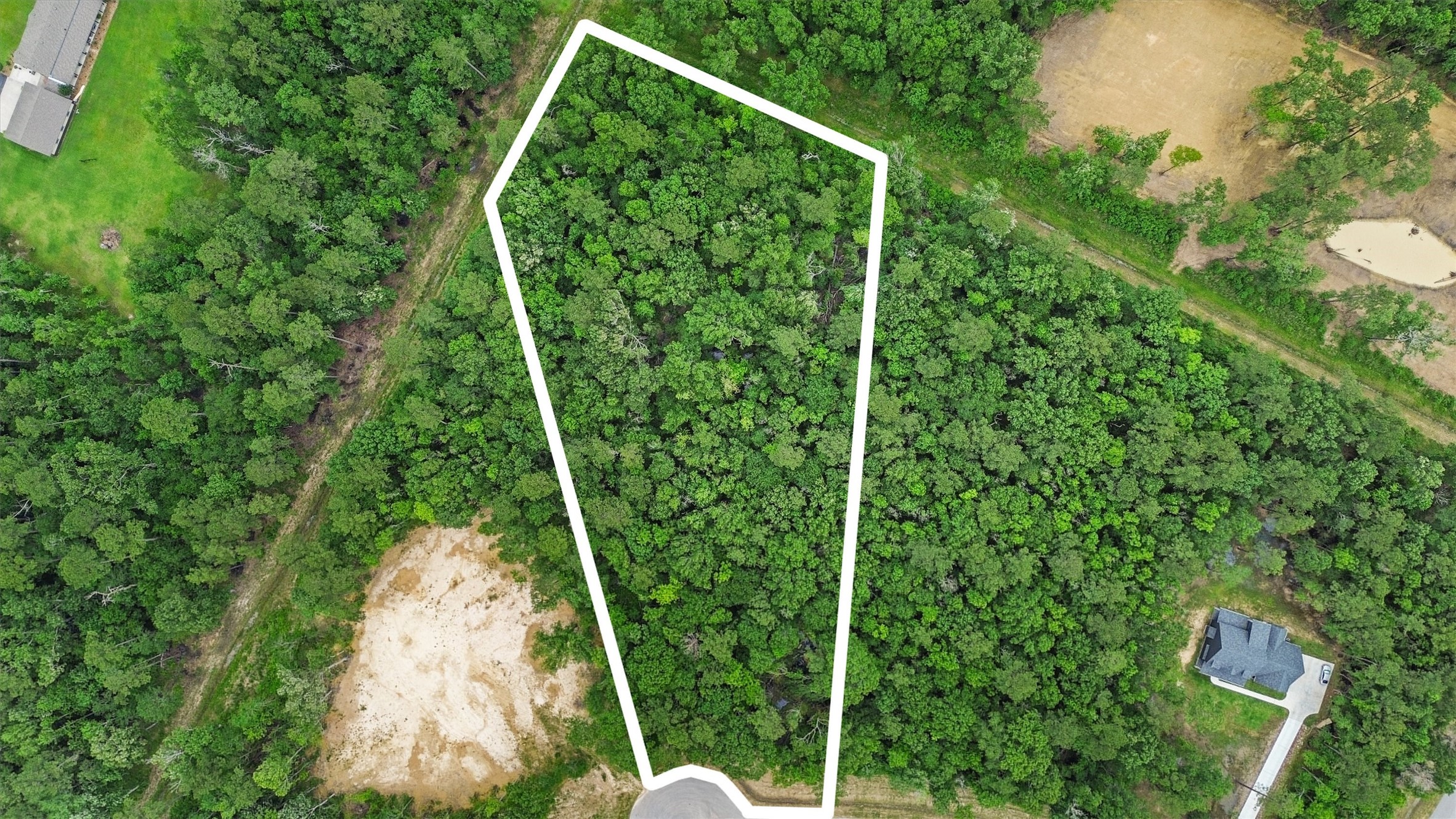 3.43 wooded acres in White Oak Trailsan exceptional opportunity to create a custom home and private acreage lifestyle in Dayton, Texas.