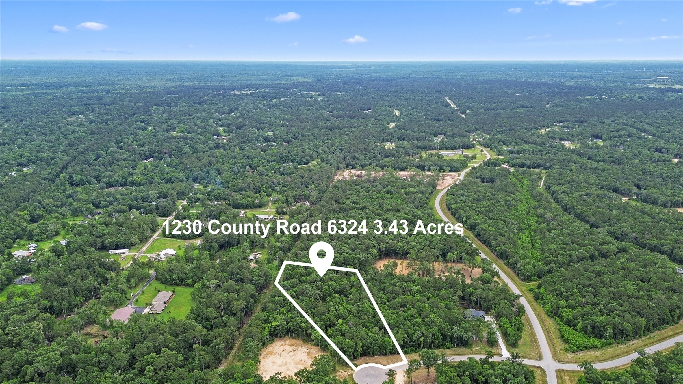Aerial property outline highlights the size and configuration of this 3.43-acre wooded residential homesite in White Oak Trails. Boundary depiction is approximate; buyer should verify by survey.