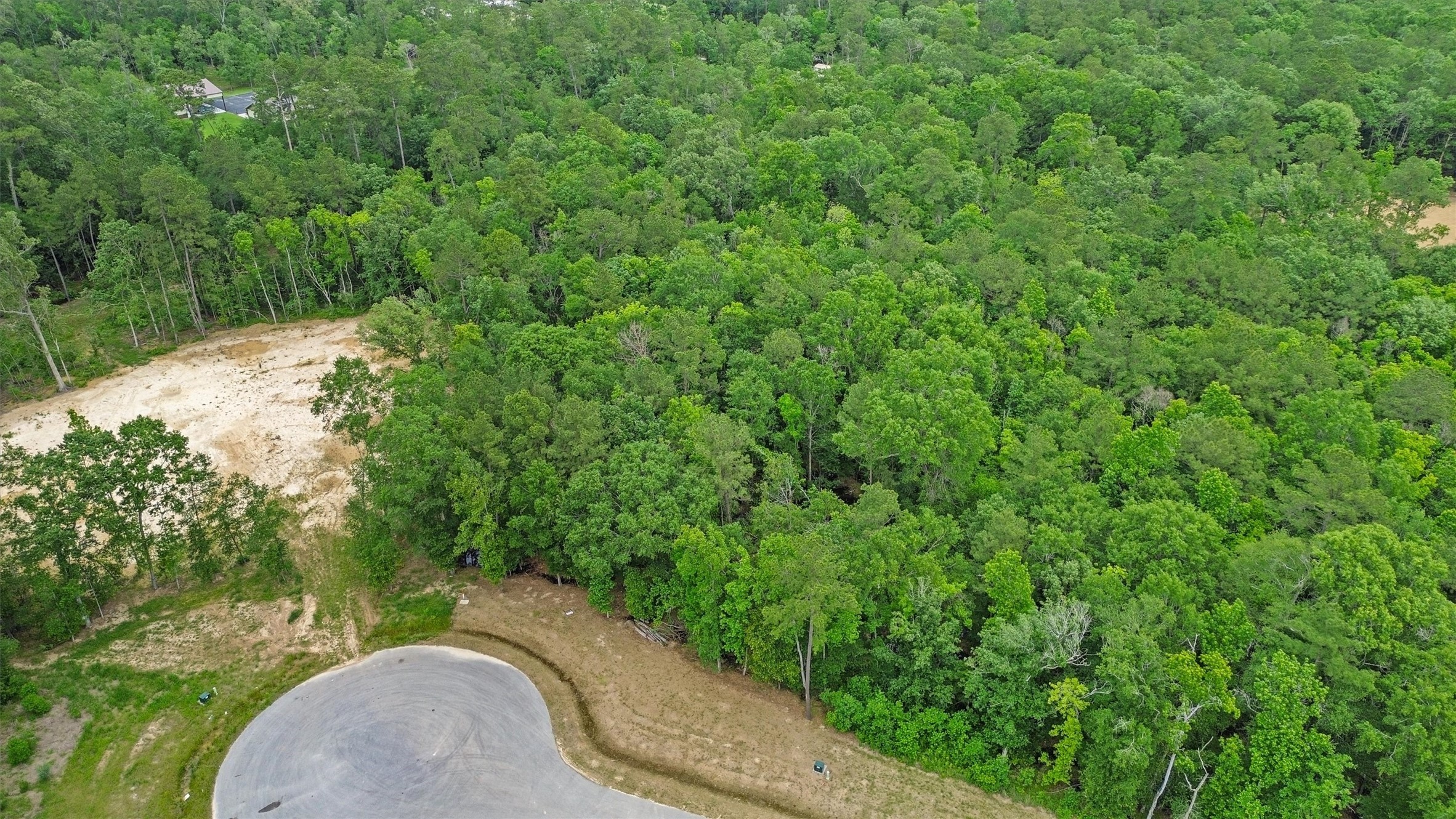 Cul-de-sac positioning adds another desirable element to this acreage homesite.