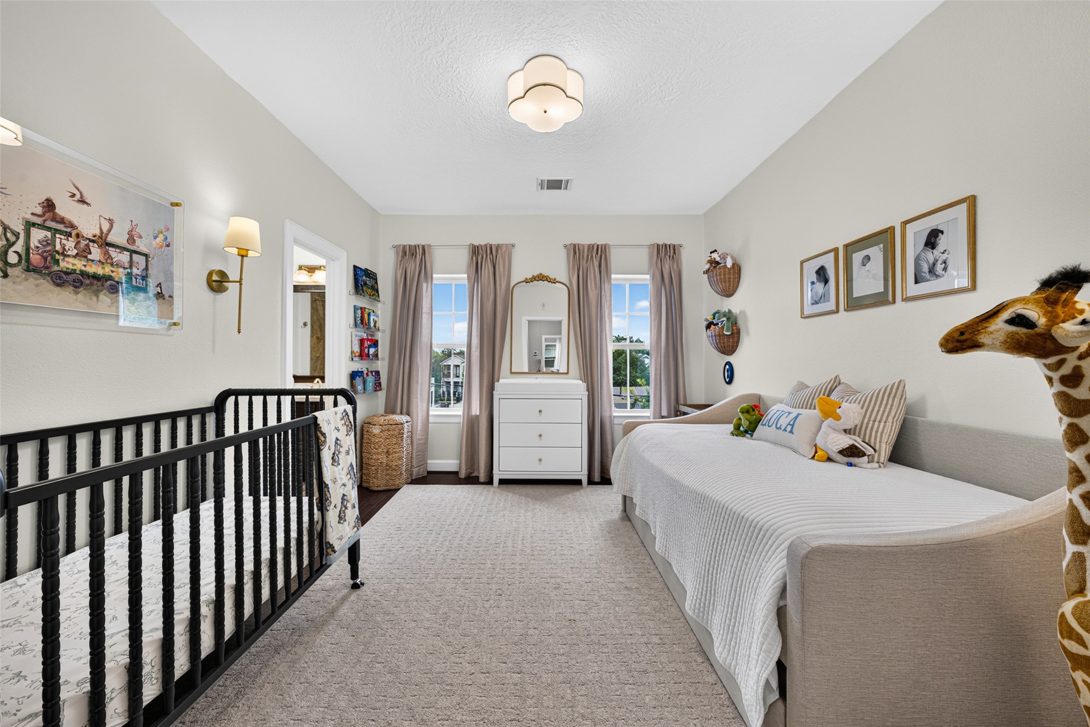 Bedroom on third-floor featuring abundant natural light and a comfortable retreat with room to relax.