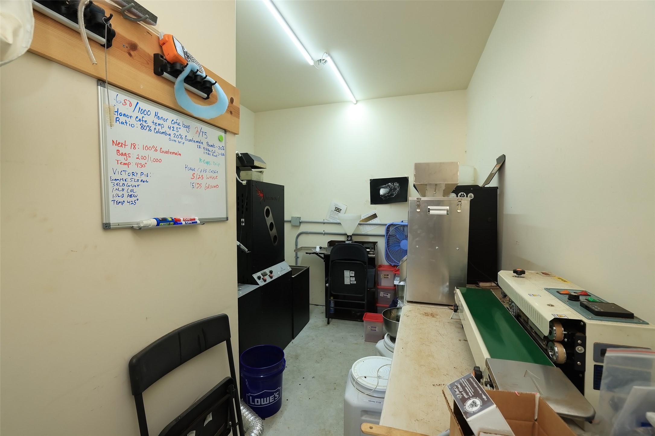Storage room in the garage with upgrade 220 plugs