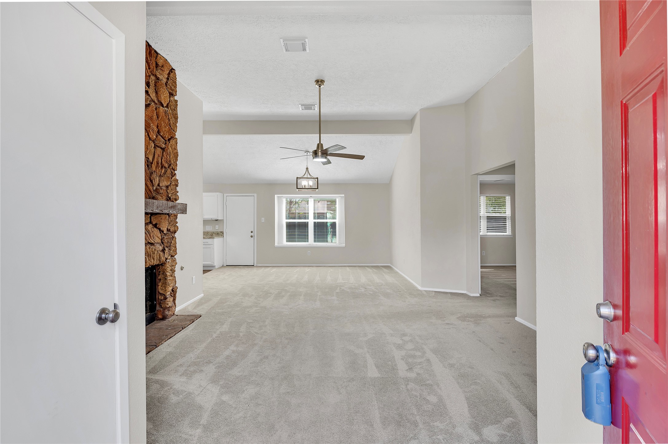 Front door opens up to the spacious living room area.