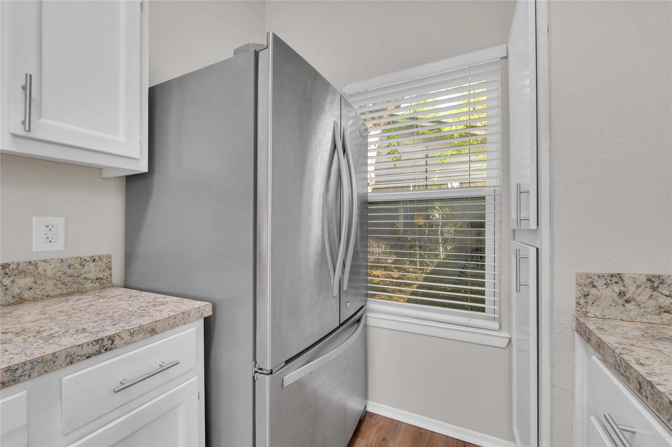 Stainless steel appliances throughout kitchen.