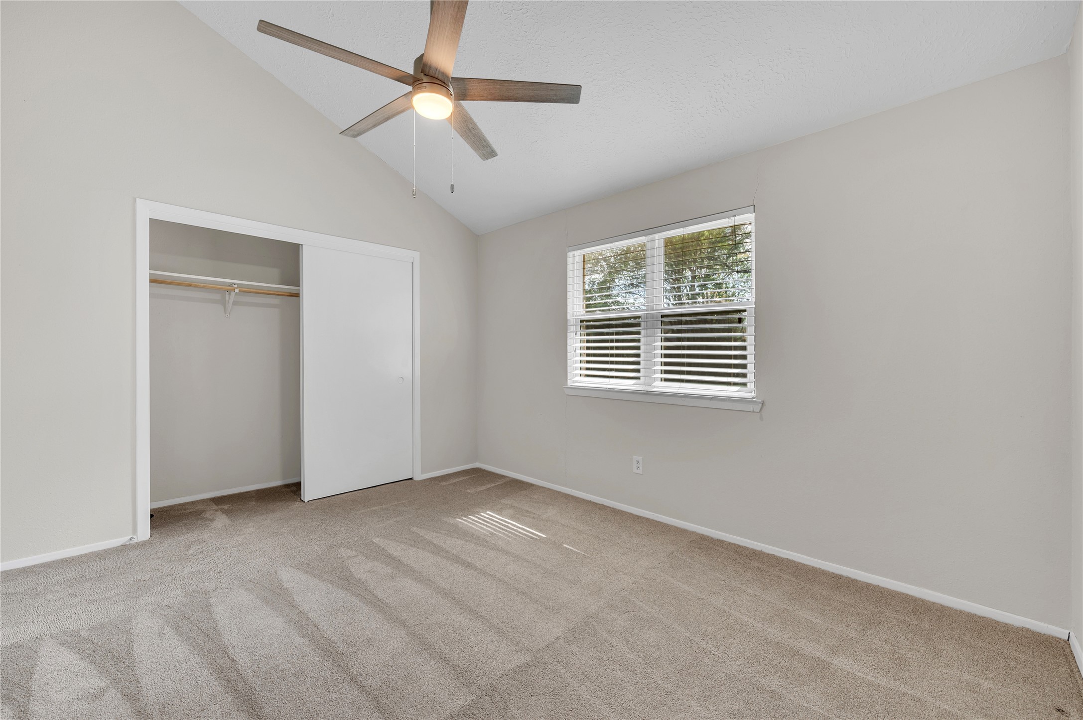 Double door closet space in the 2nd bedroom.