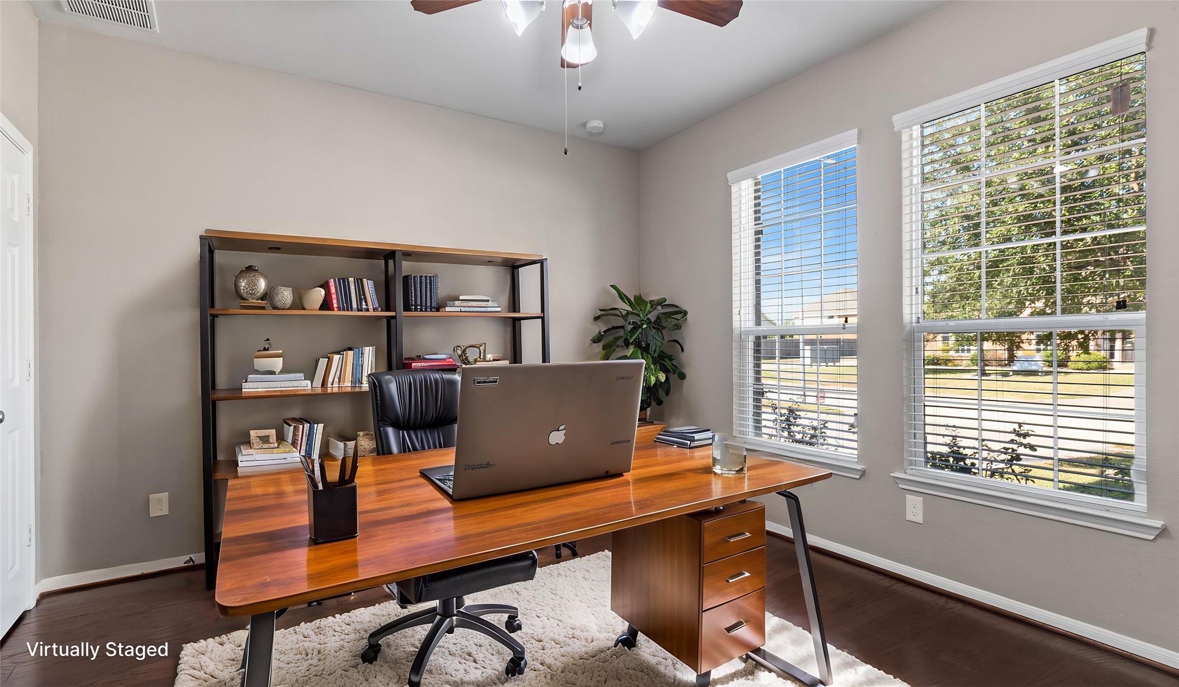 A nicely stated office space with french doors is just to your right as you enter the home. Large windows keep this space bright and it does have it's own closet!