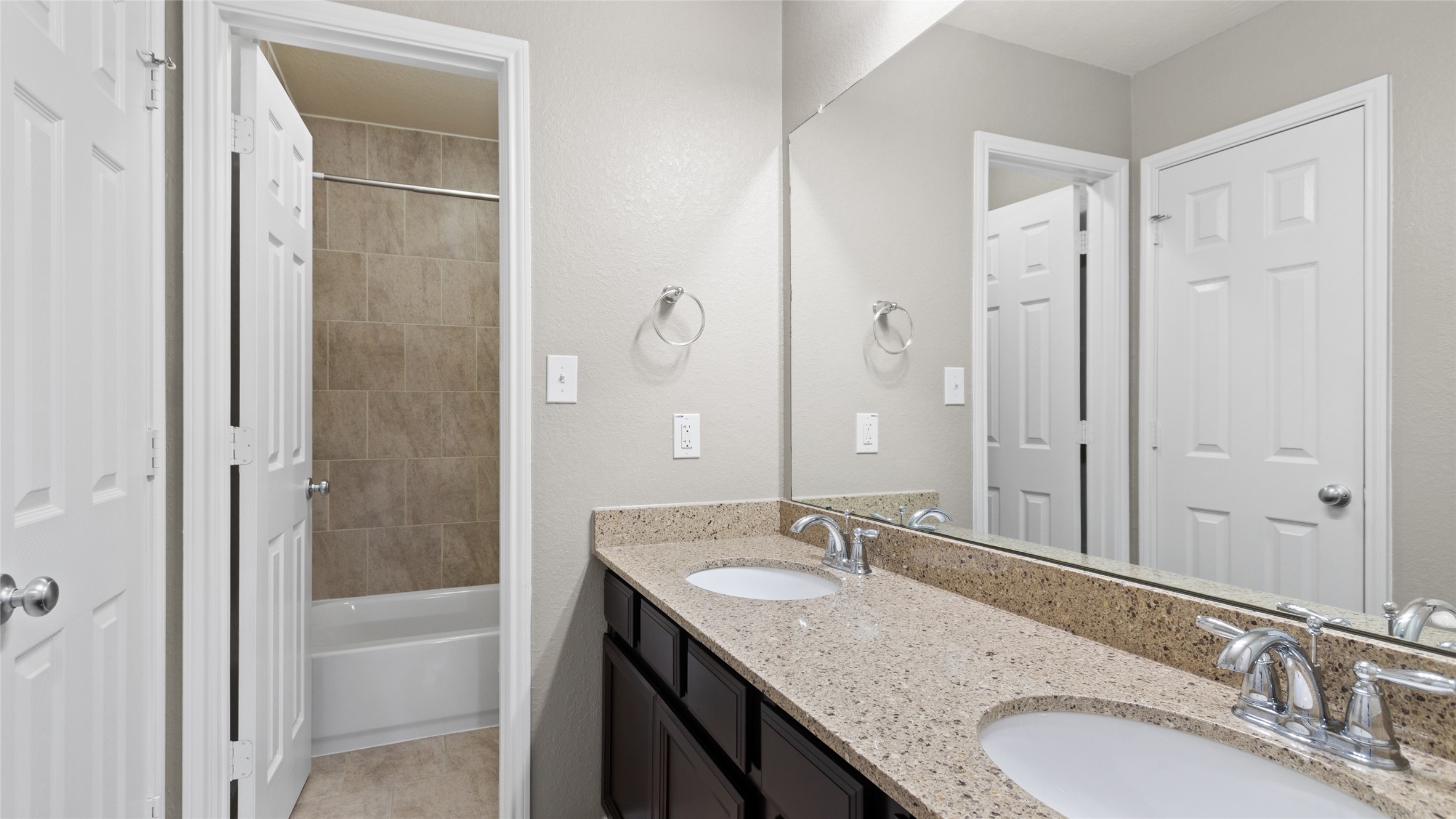 Large double vanity, plenty of storage space and a seperate tub/shower in this secondary bathroom located upstairs.