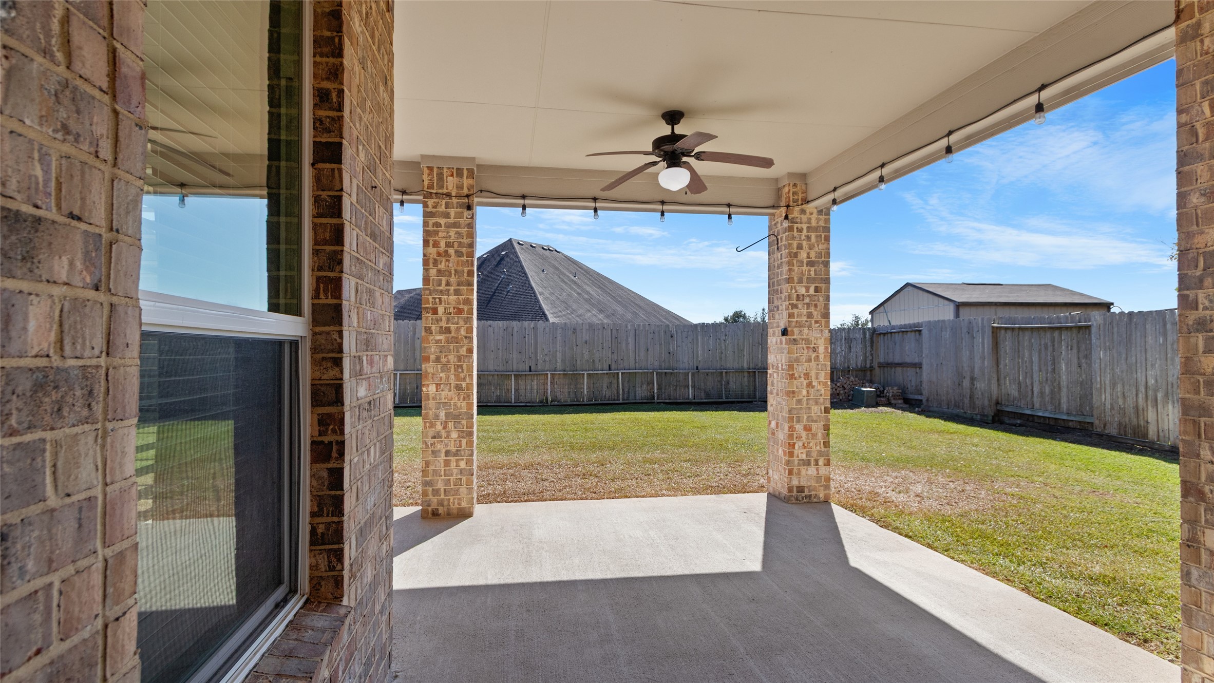 Exit out into this beautiful large brick patio space just perfect for family and friends to gather!