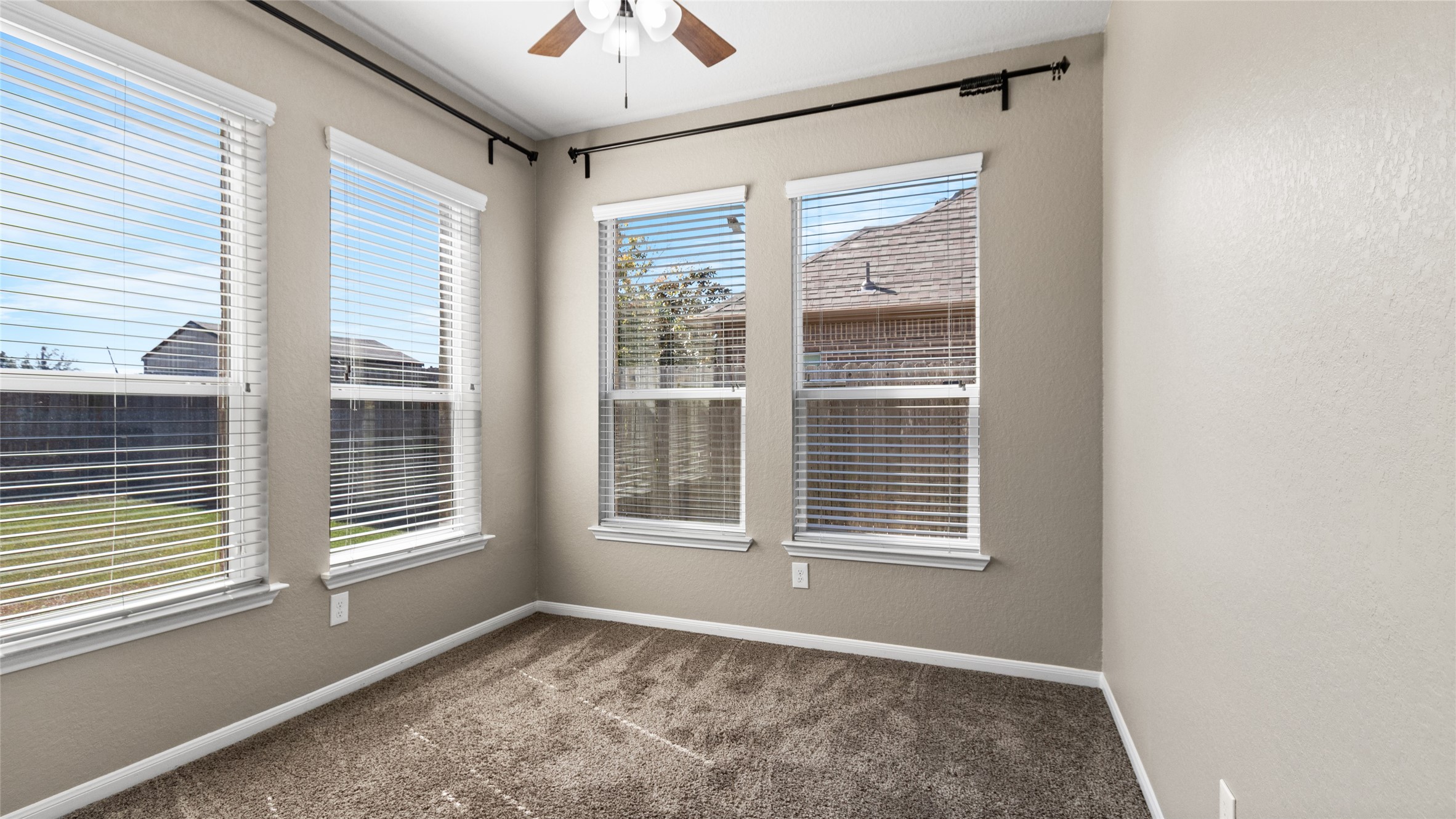 This sunroom offers a versatile, light-filled space that can easily be reimagined to suit your lifestylewhether you choose to use it as a cozy reading nook, a productive home office, or a creative studio, the possibilities are endless.