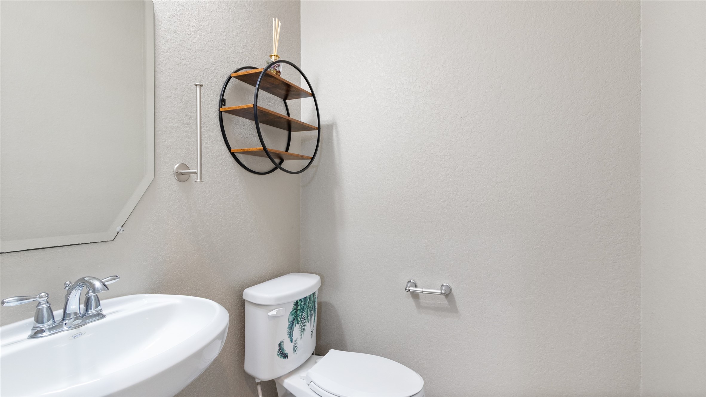This is the half bath just steps away from the office on the first level.