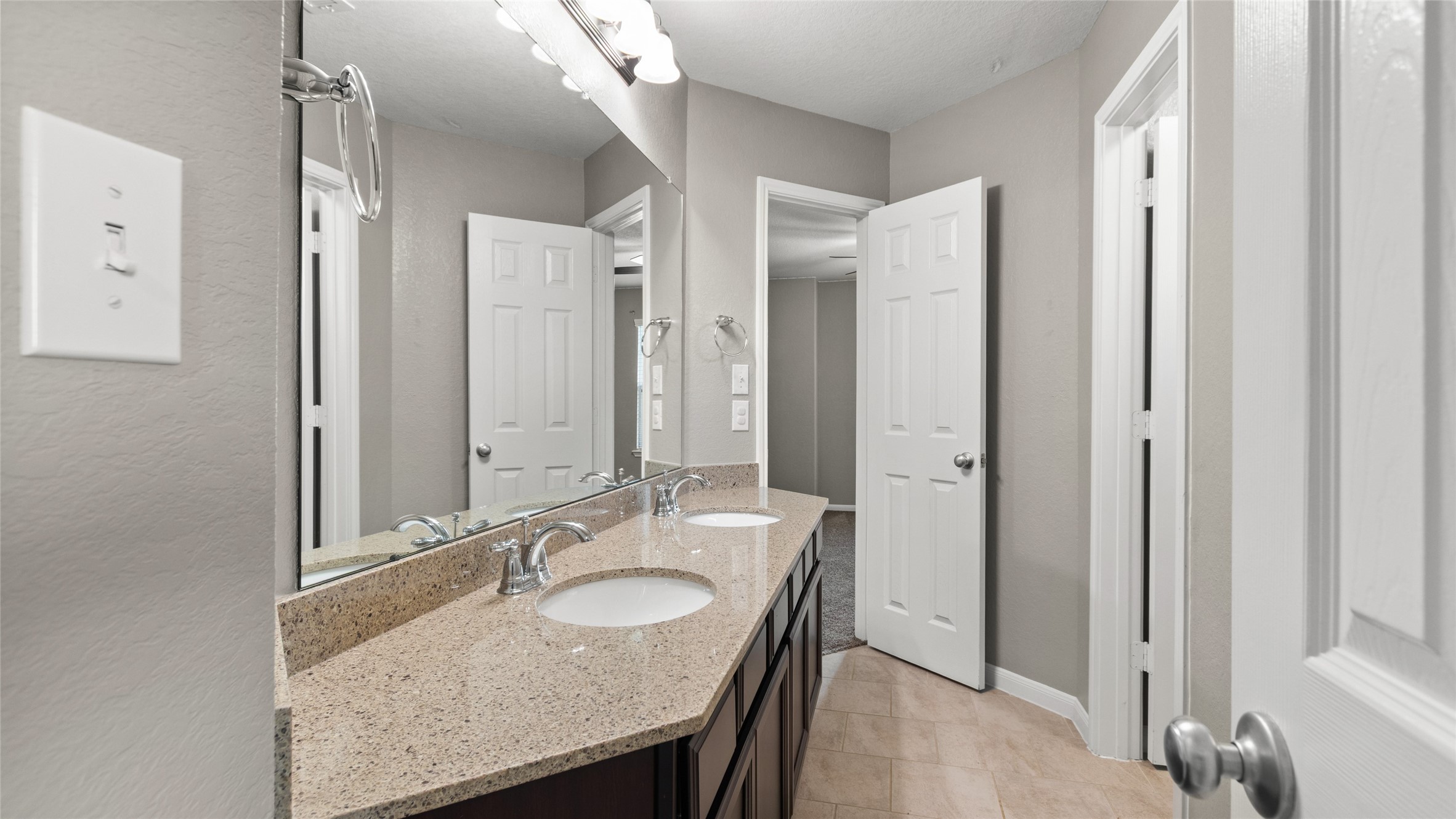 Hollywood style bathroom upstairs shared by two bedrooms.