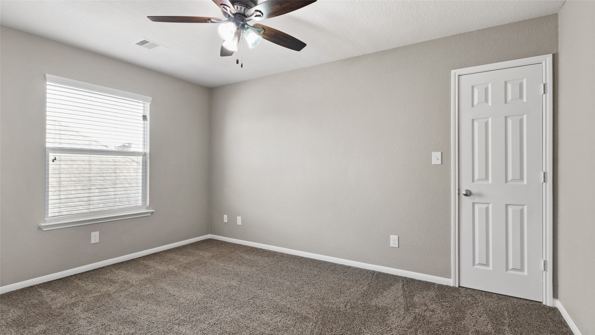 Secondary bedroom upstairs that shares a hollywood style bathroom with another bedroom.