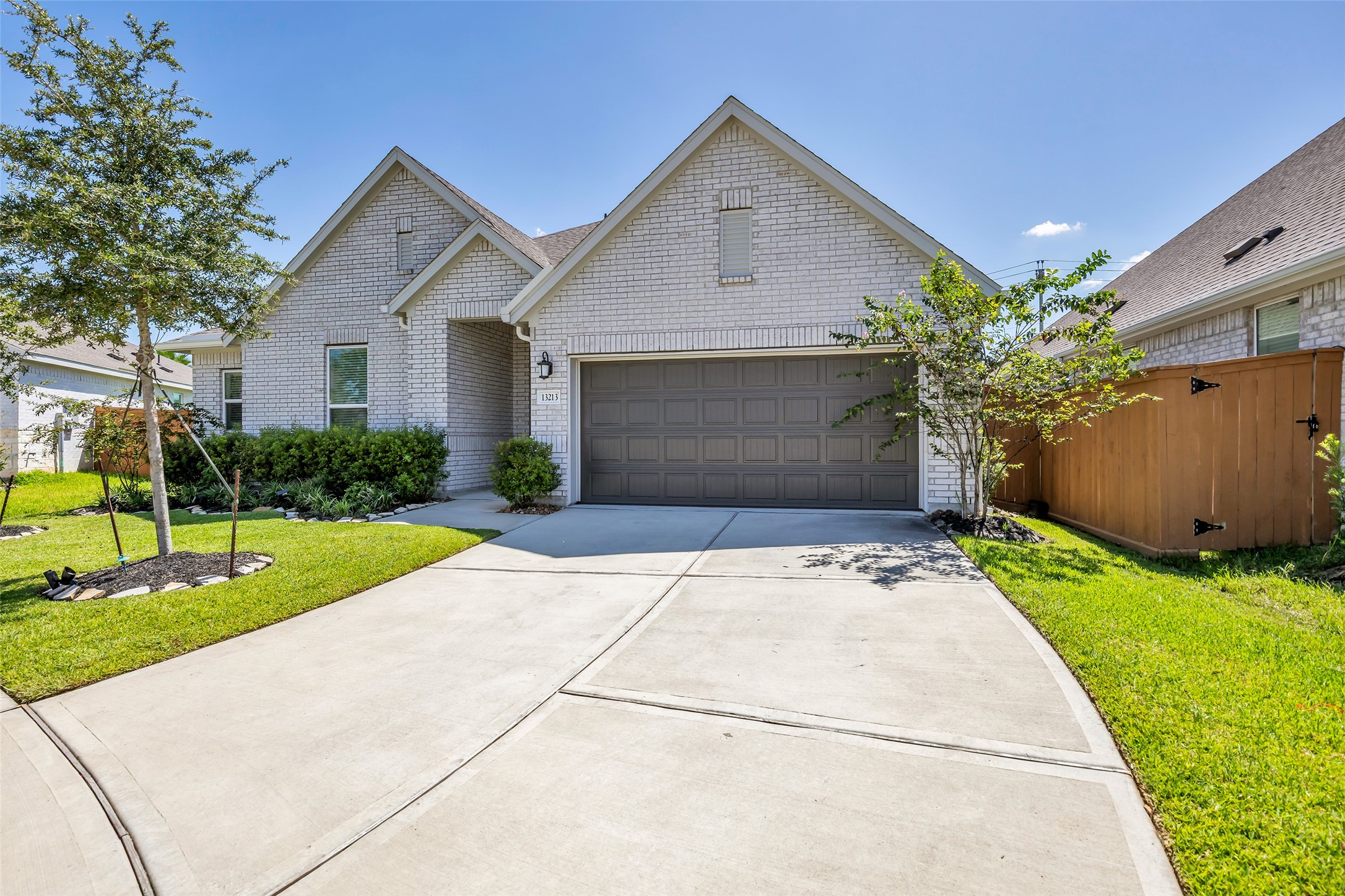 Lovely single-story home with a modern brick faade and manicured landscaping. Features a spacious two-car garage and a welcoming front entrance. Lovely single-story home with a modern brick faade and manicured landscaping. Features a spacious two-car garage and a welcoming front entrance.