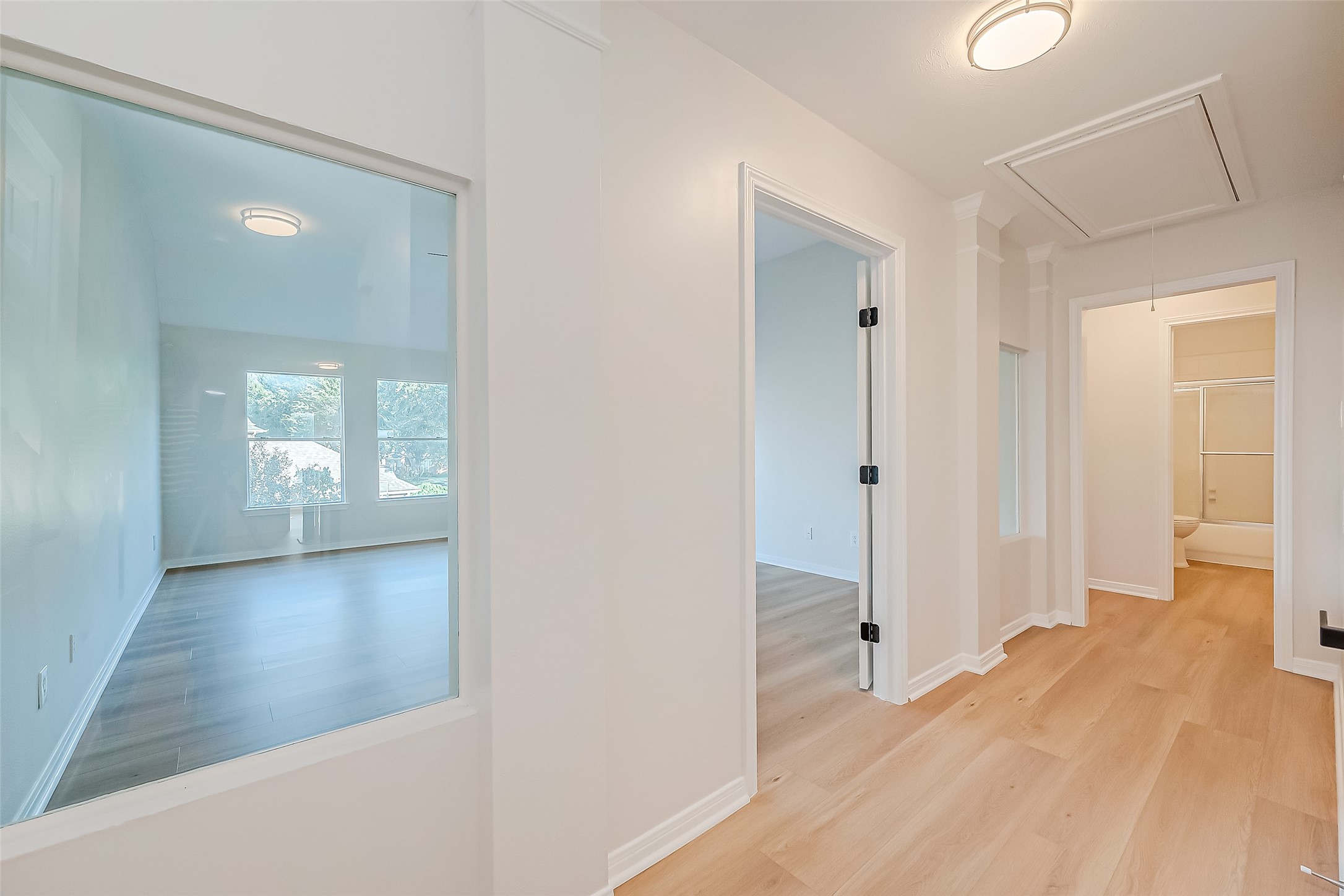 large versatile room with glass windows and WIC