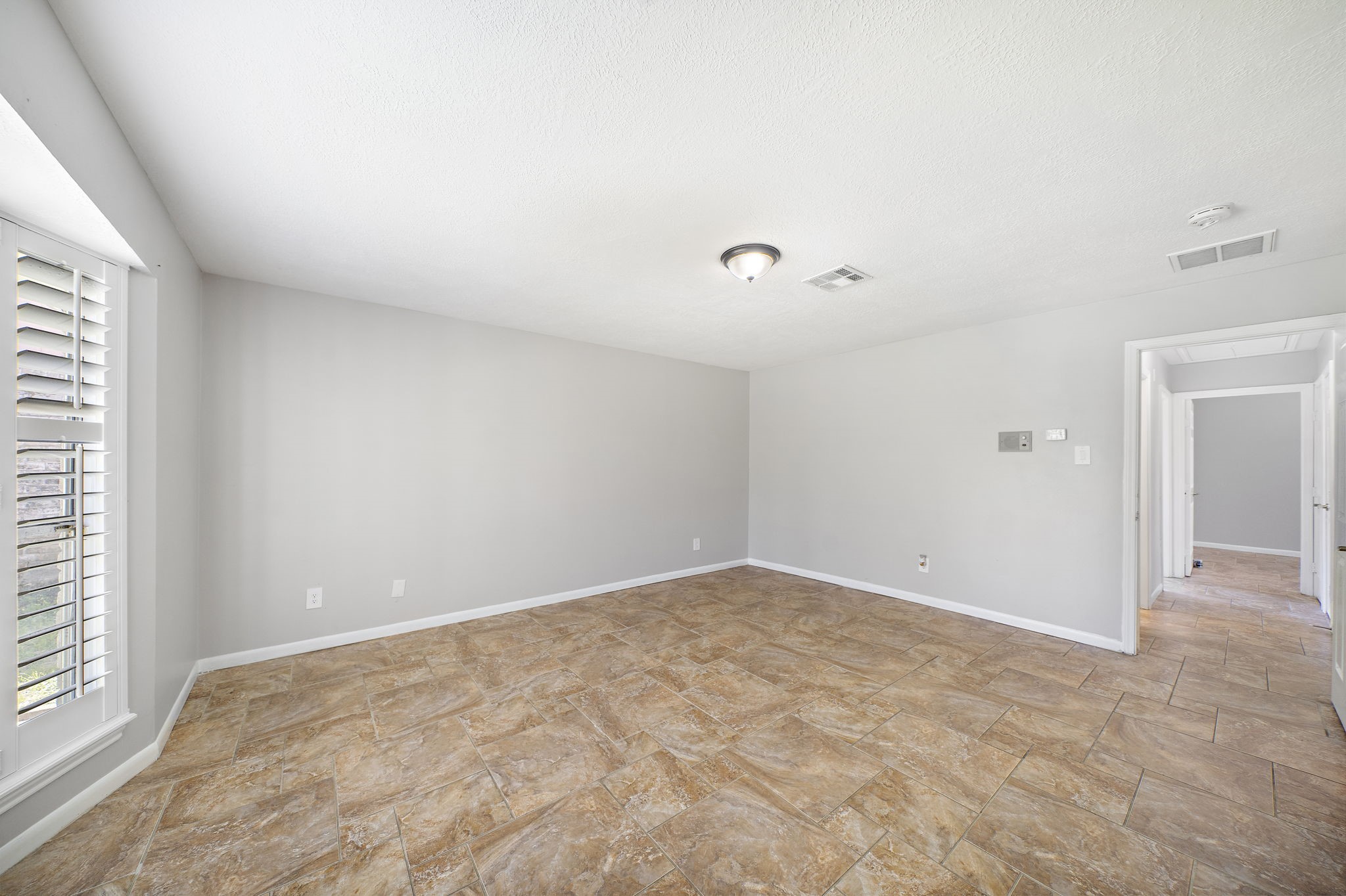 Another view of primary bedroom