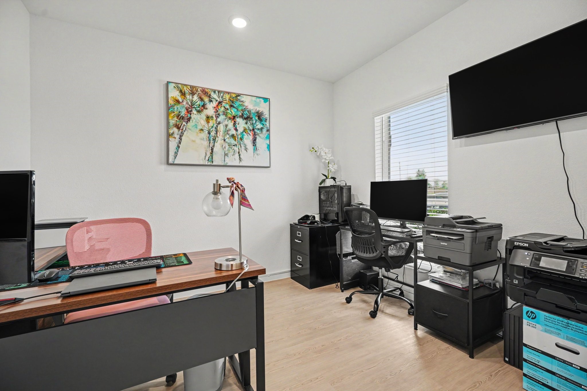Private study with glass French doors, abundant natural light, and flexibility for a home office, hobby room, or additional living space.