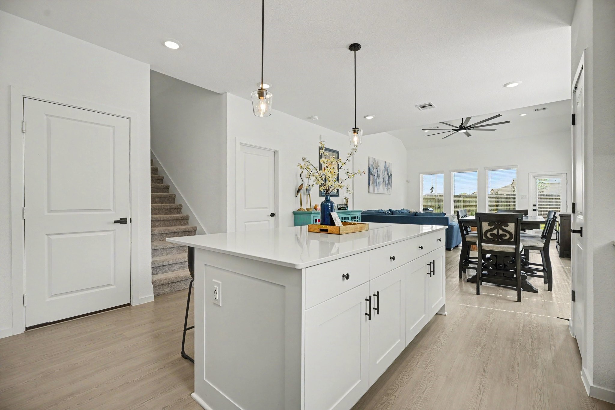 Oversized island offers additional storage, workspace, and seating while maintaining an open connection to the dining and living areas. Oversized island offers additional storage, workspace, and seating while maintaining an open connection to the dining and living areas.