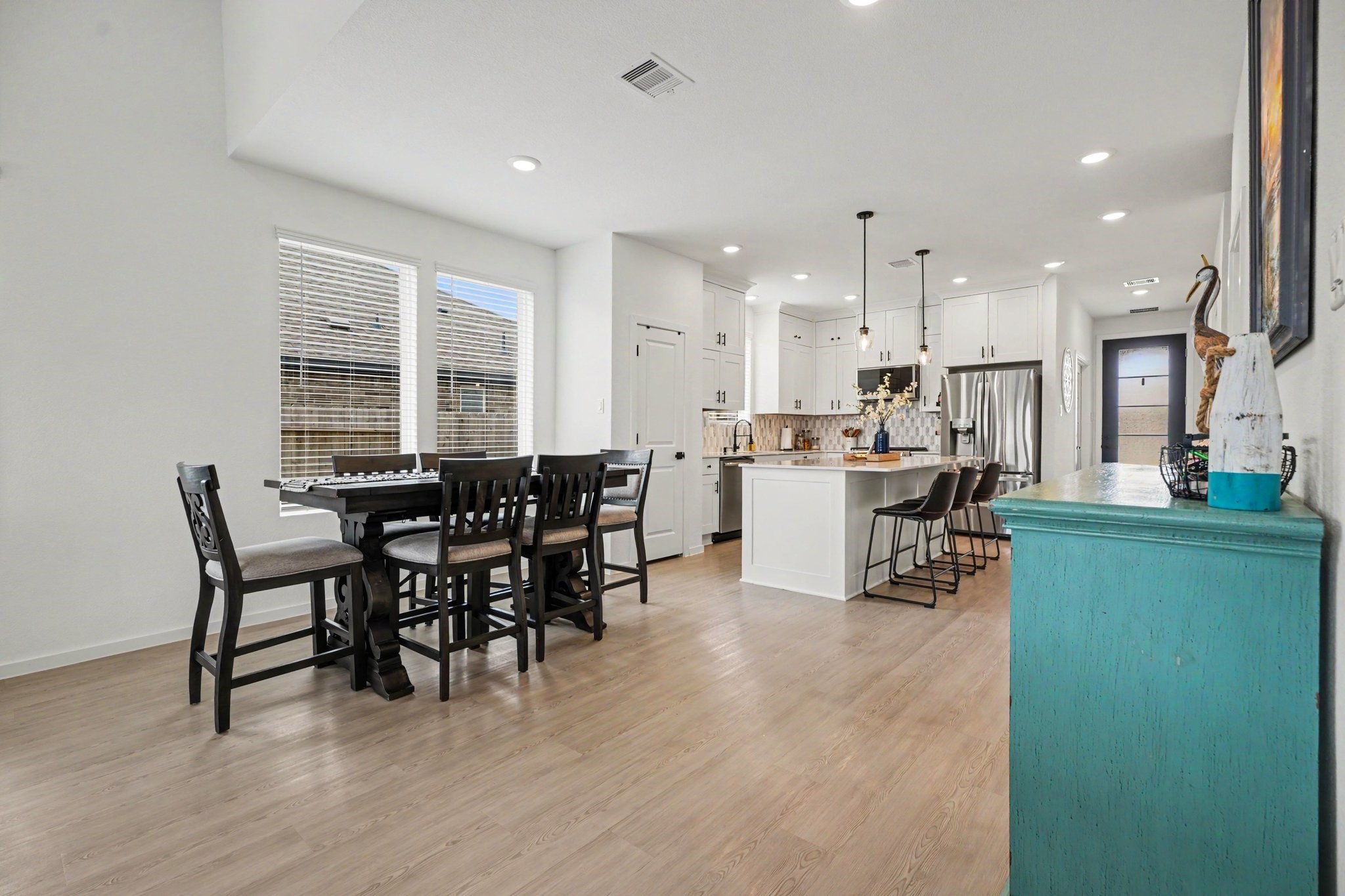 Open-concept dining area with abundant natural light and a seamless connection to the kitchen, creating an inviting and functional layout.