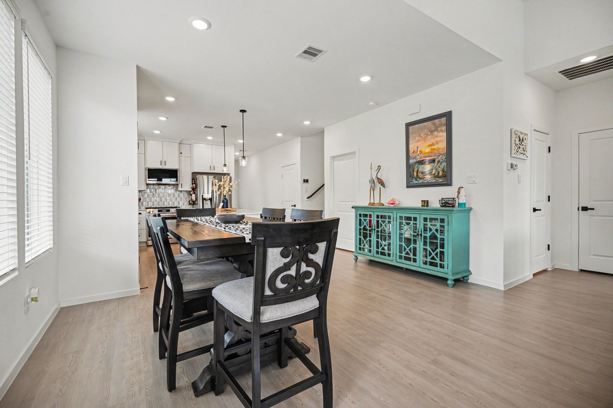 Dining area positioned within the open-concept layout, providing a seamless flow between the kitchen and main living spaces.