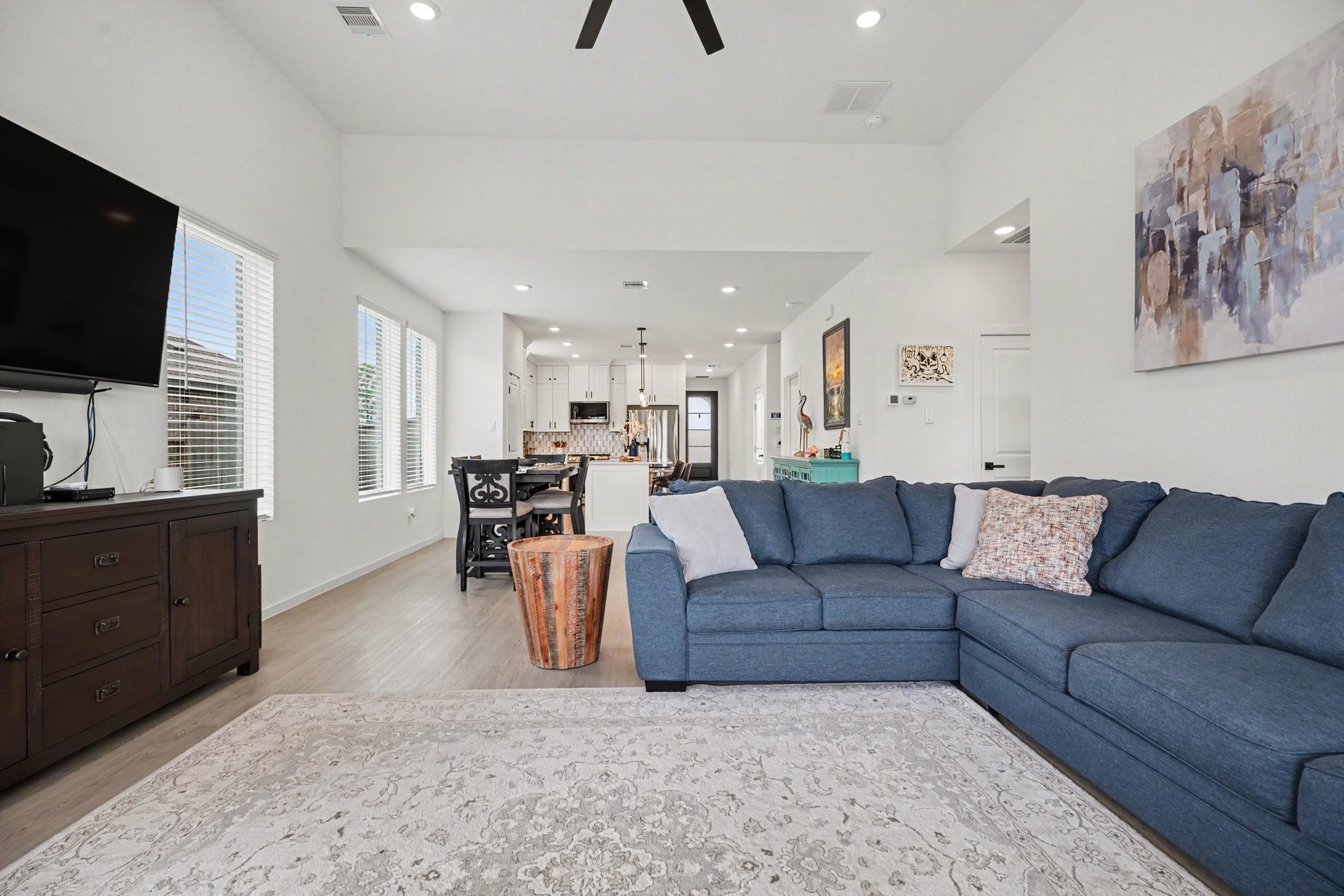 Living area offers plenty of space for seating arrangements while maintaining an open flow to the kitchen and dining areas.