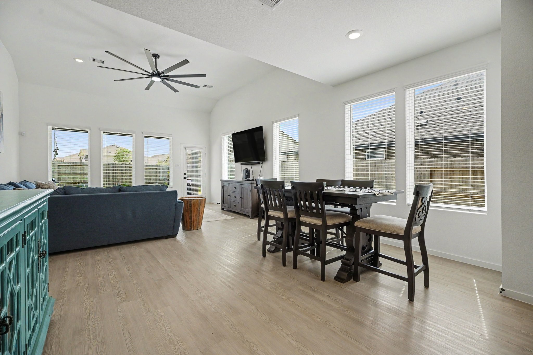 Spacious living and dining areas with soaring ceilings, abundant natural light, and an open layout ideal for a variety of furniture arrangements.