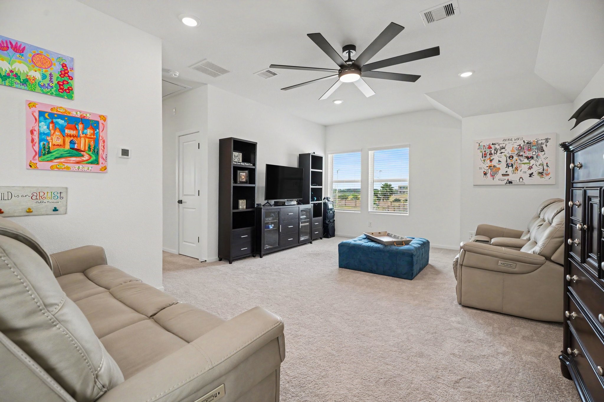 Alternate view of the game room showcasing its generous size, vaulted ceiling, and flexible layout.