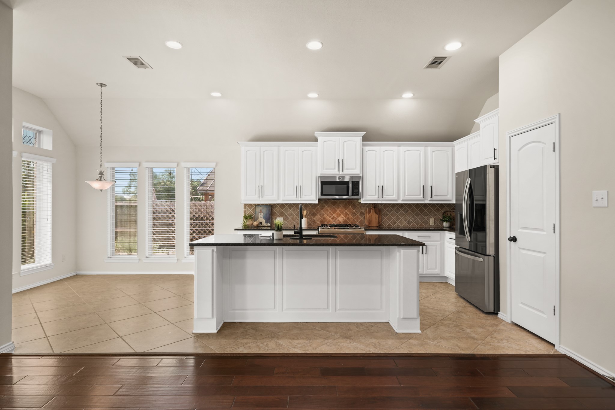 Large center island overlooks the living area, creating the perfect space for entertaining and everyday living. Large center island overlooks the living area, creating the perfect space for entertaining and everyday living.