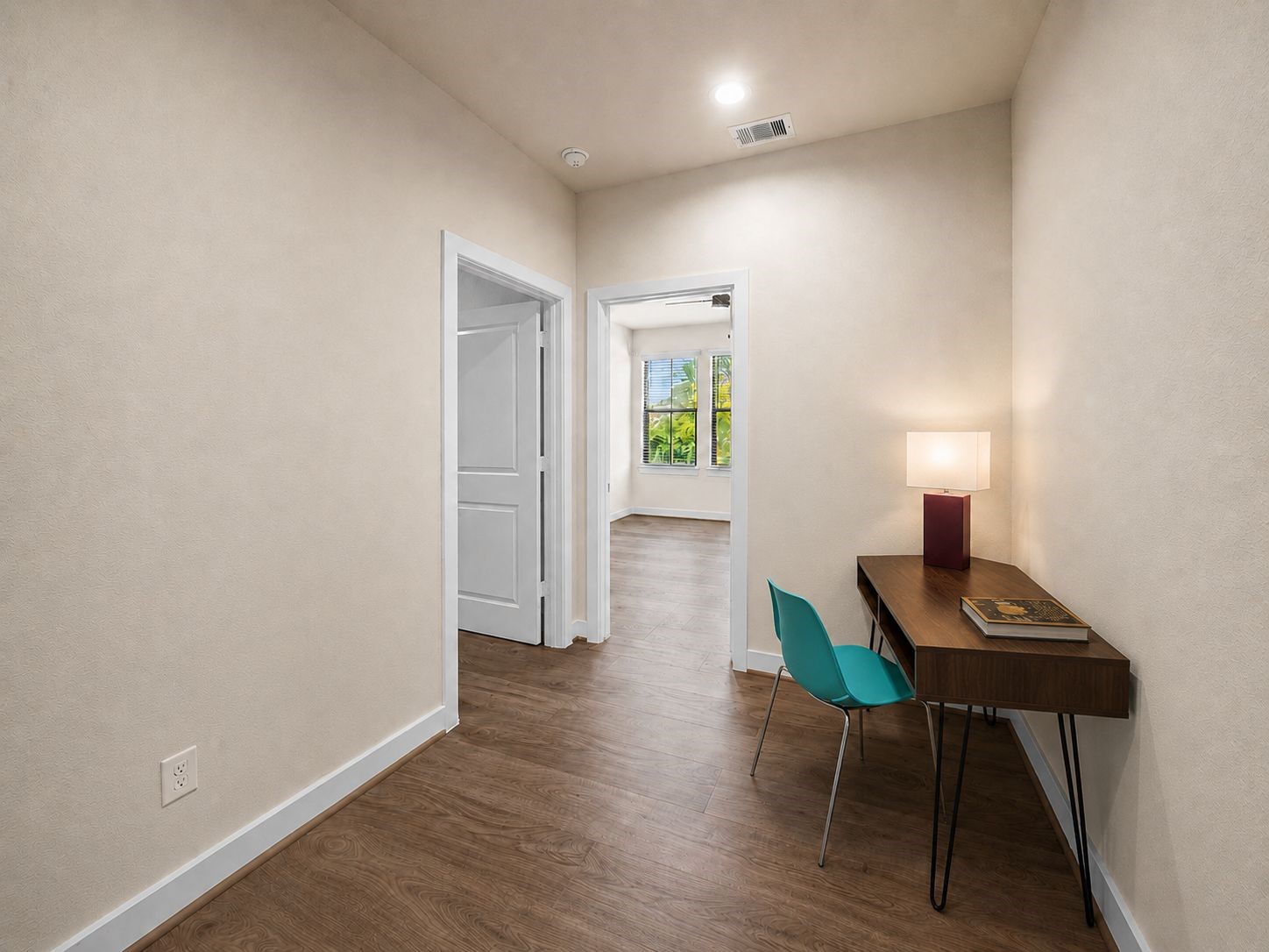 Need an additional office nook without using 1 of the 3 bedrooms? This space between the secondary bedrooms works perfectly for this! Easily flex into a reading nook or hobby area of your choice.