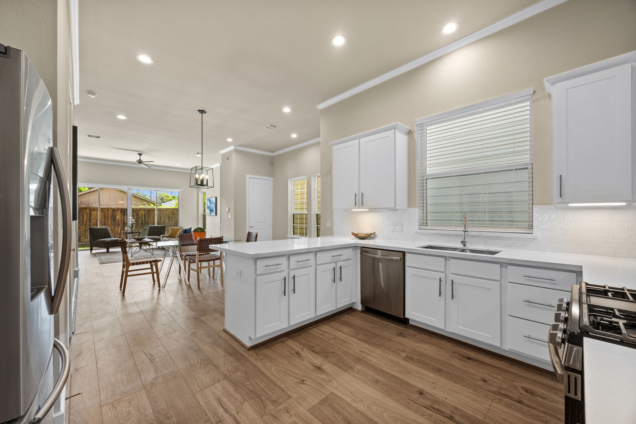 The open concept makes entertaining a breeze! Notice all of the natural light throughout the 1st floor.