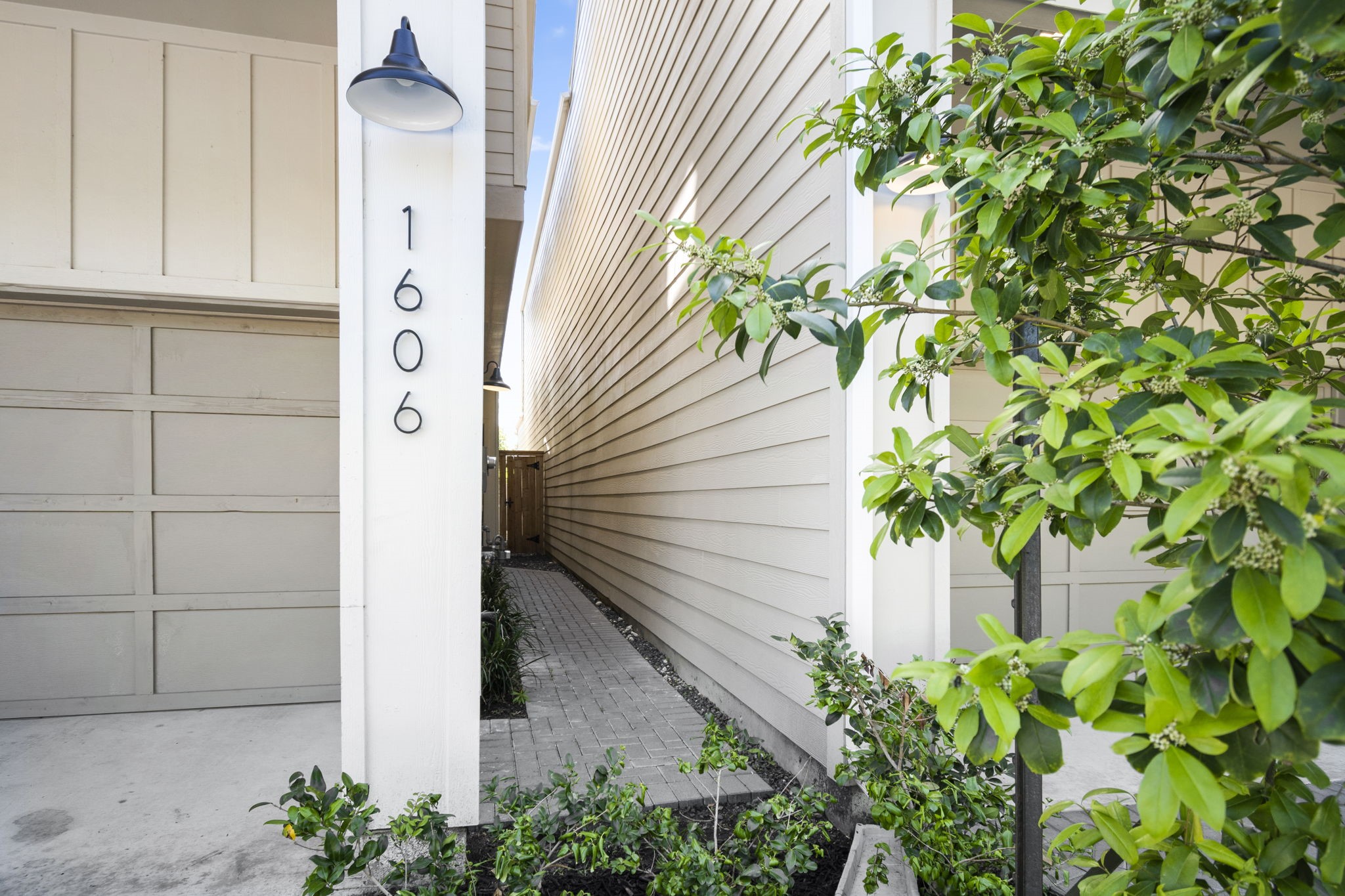 Pavered walkway to your front door which is also gated (gate open for the picture so not visible).