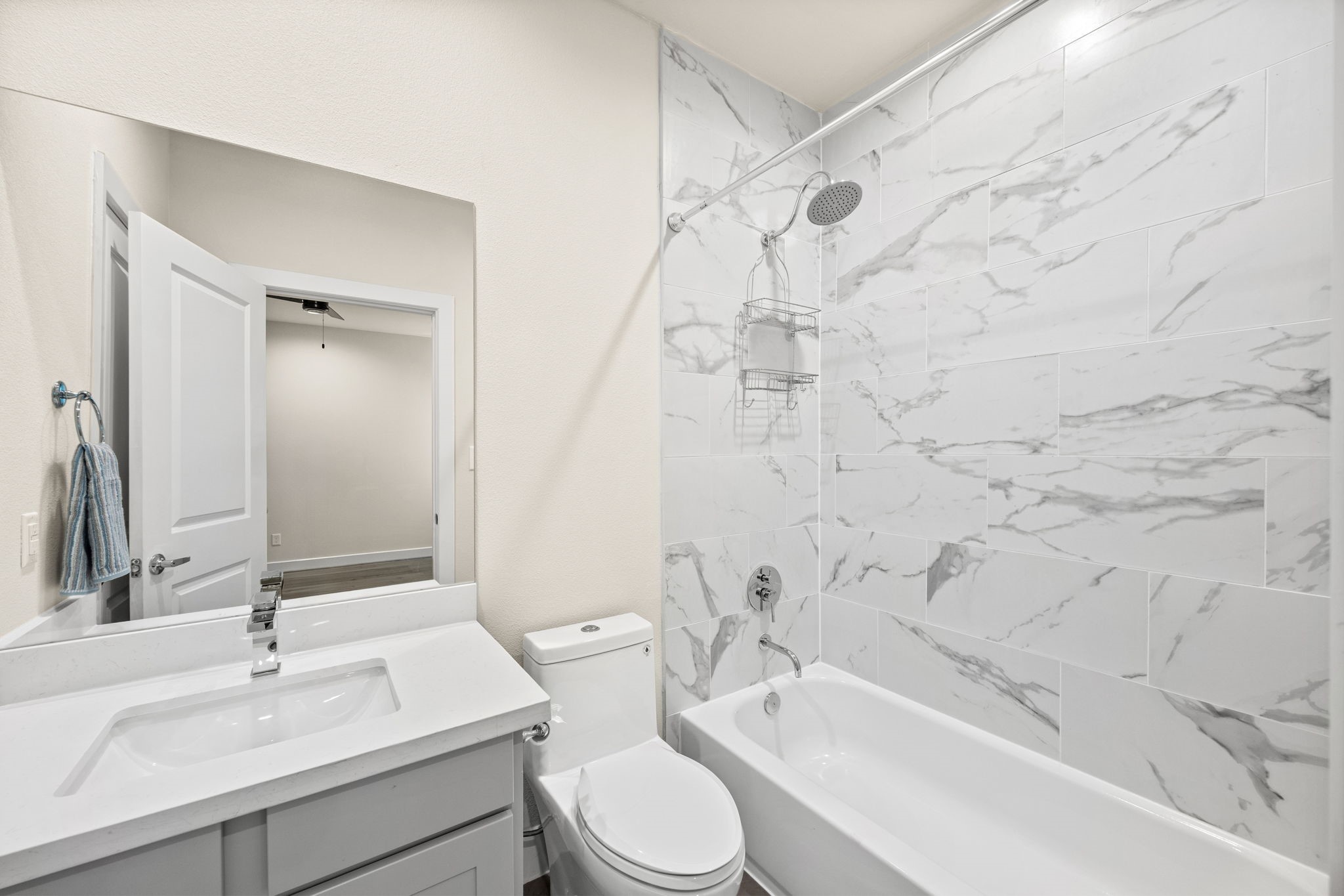 Full en-suite bathroom for the middle secondary bedroom.