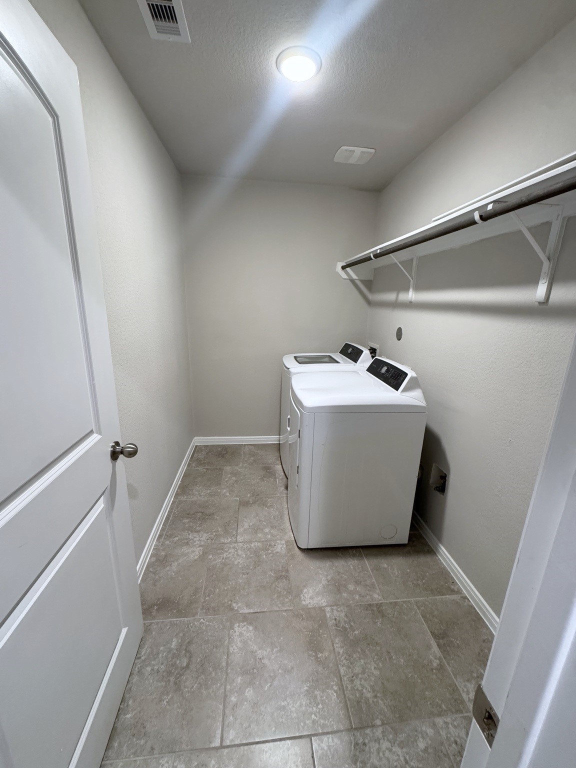 Large Laundry room with shelving and room for full fridge