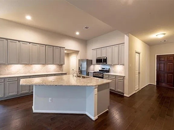 Kitchen island doubles as a breakfast table with plenty of bar top seating