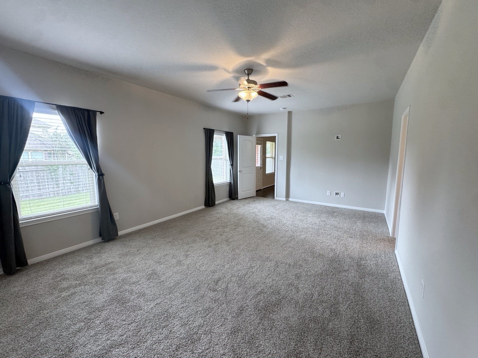 Large master bedroom with sitting area