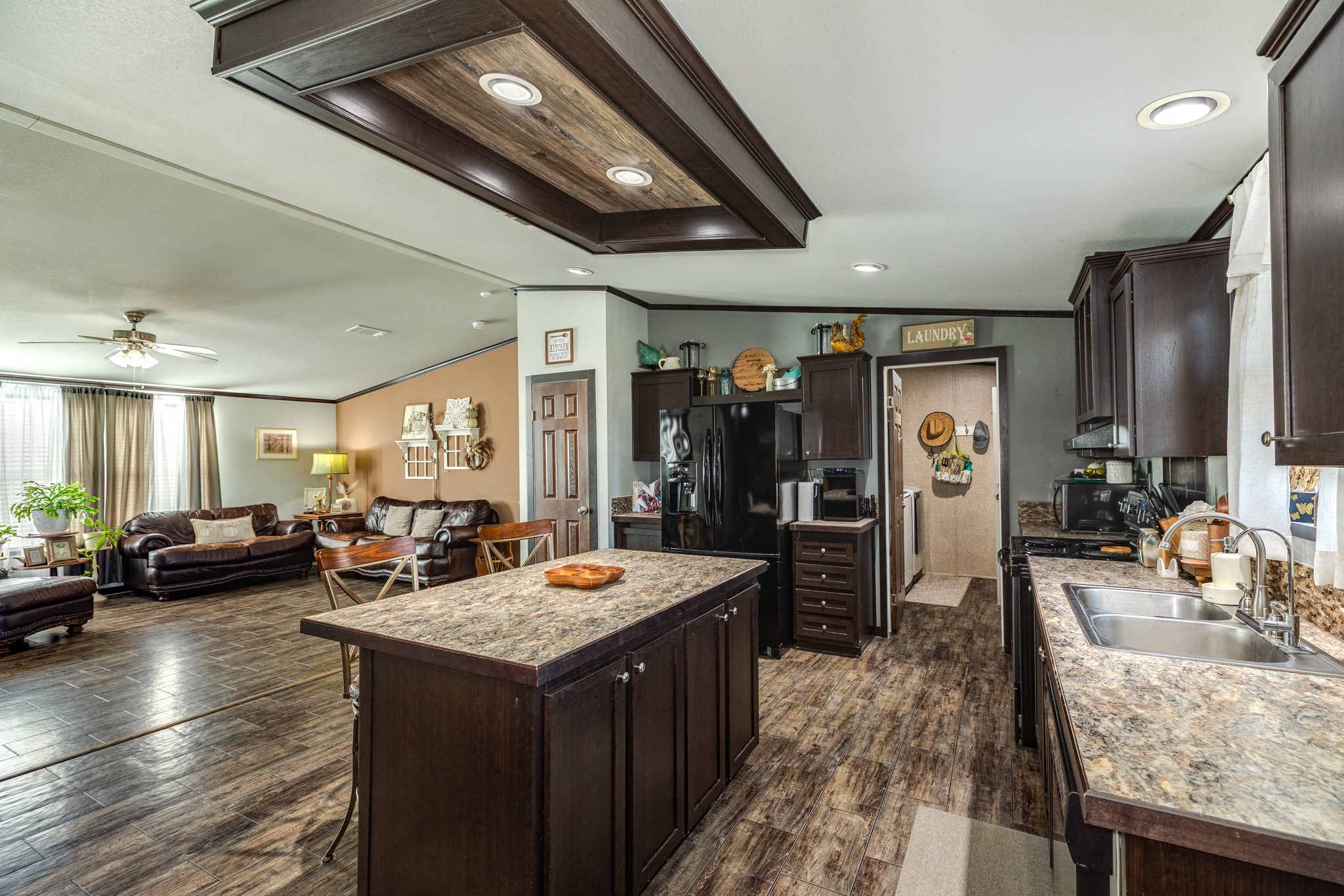 Open-concept family room flowing into the kitchen.